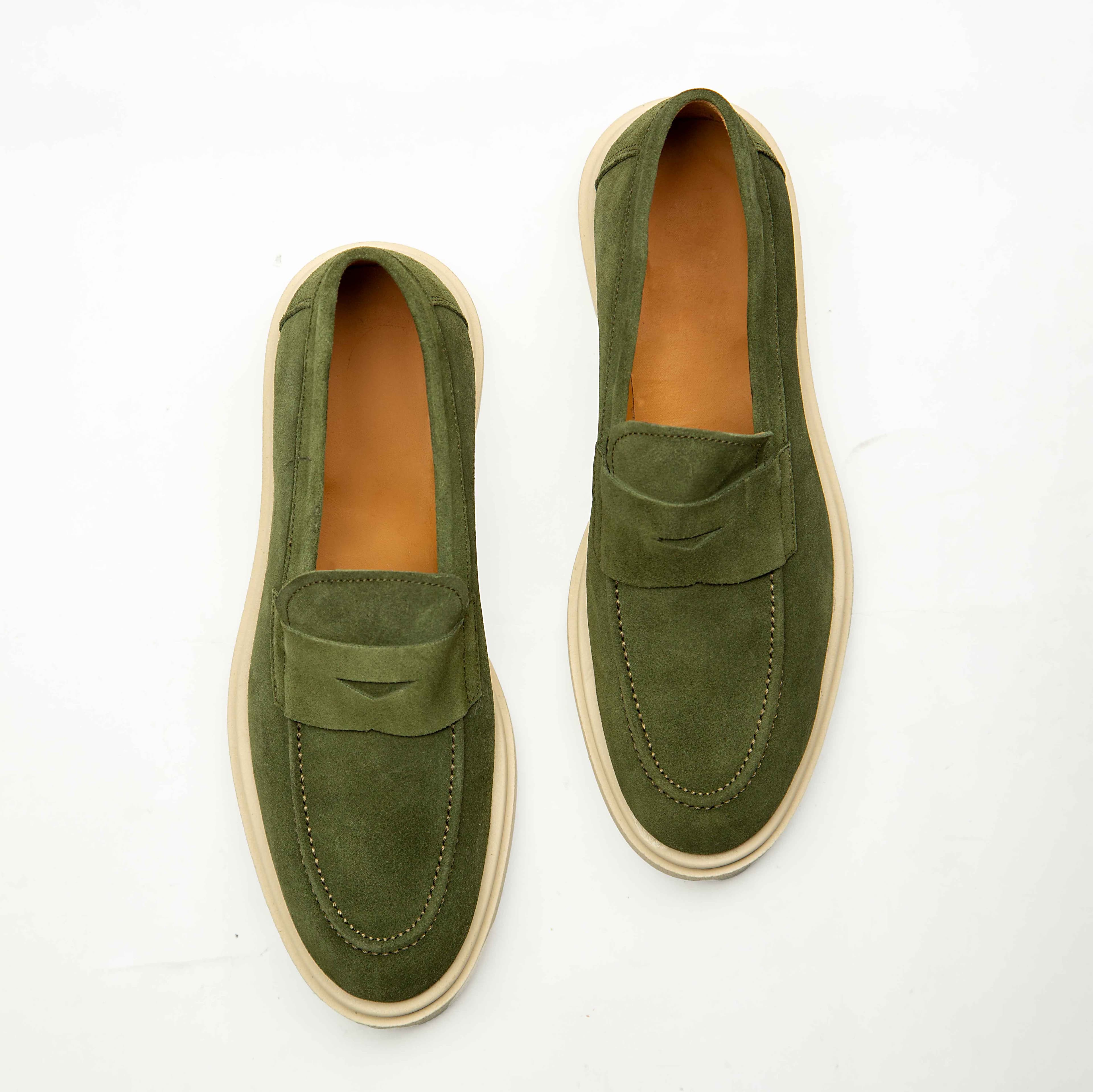 Agu & Sons Ltd olive green suede penny loafers featuring a thick cream platform rubber sole, isolated on a white background.