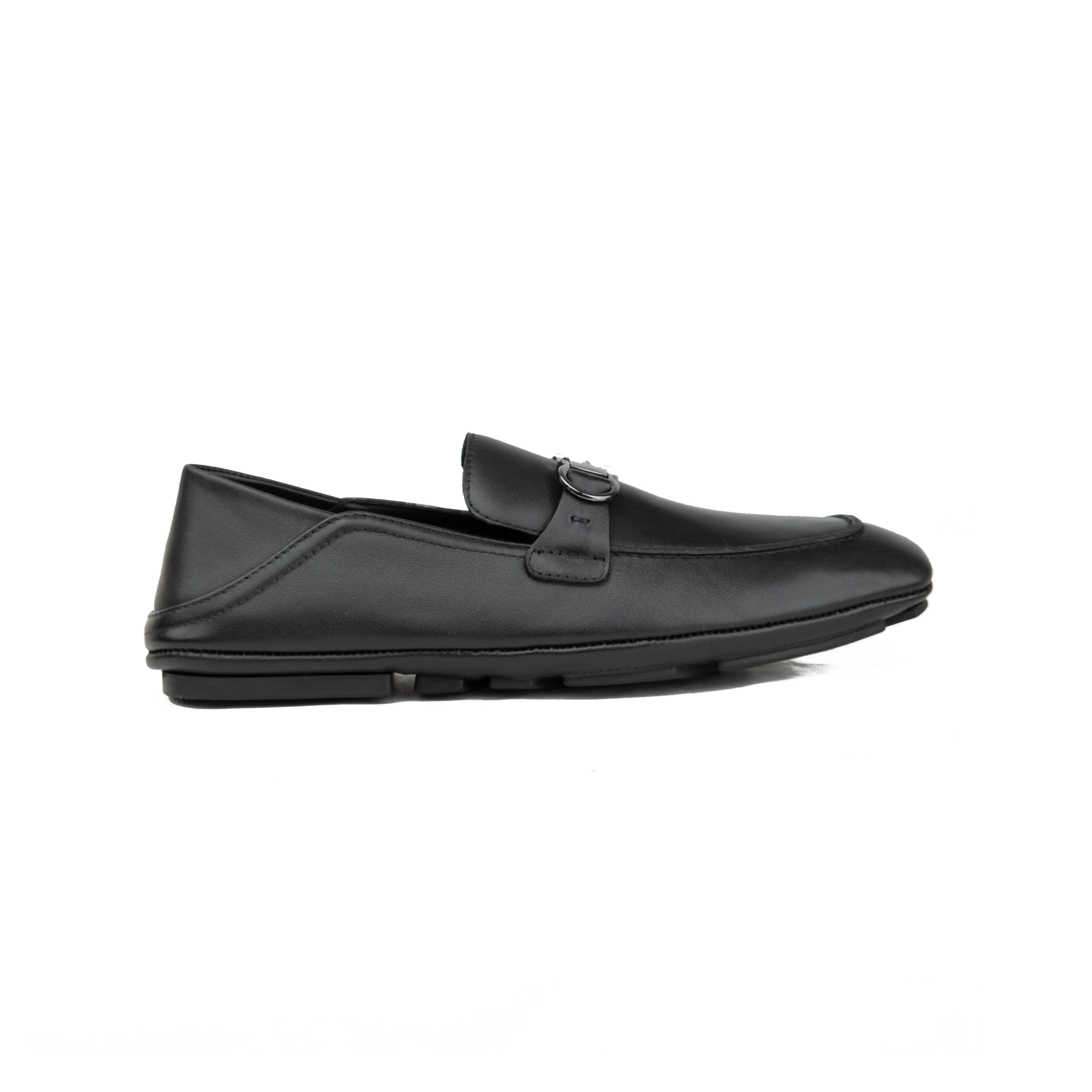 Pair of black Ferragamo Gancini leather driver loafers with silver buckle on a white background.