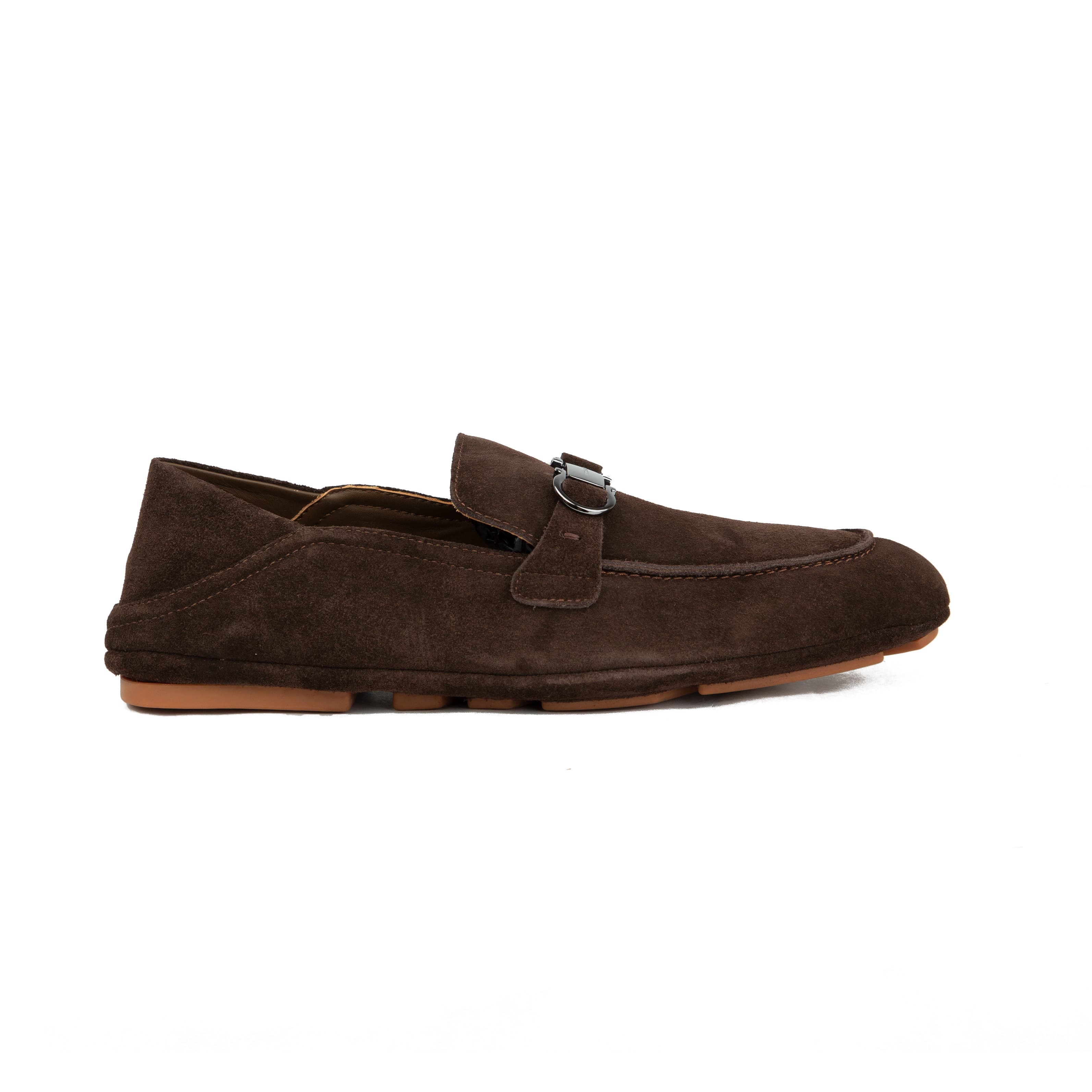 Chocolate brown suede Ferragamo Gancini loafers with collapsible heel and gum sole on white background.