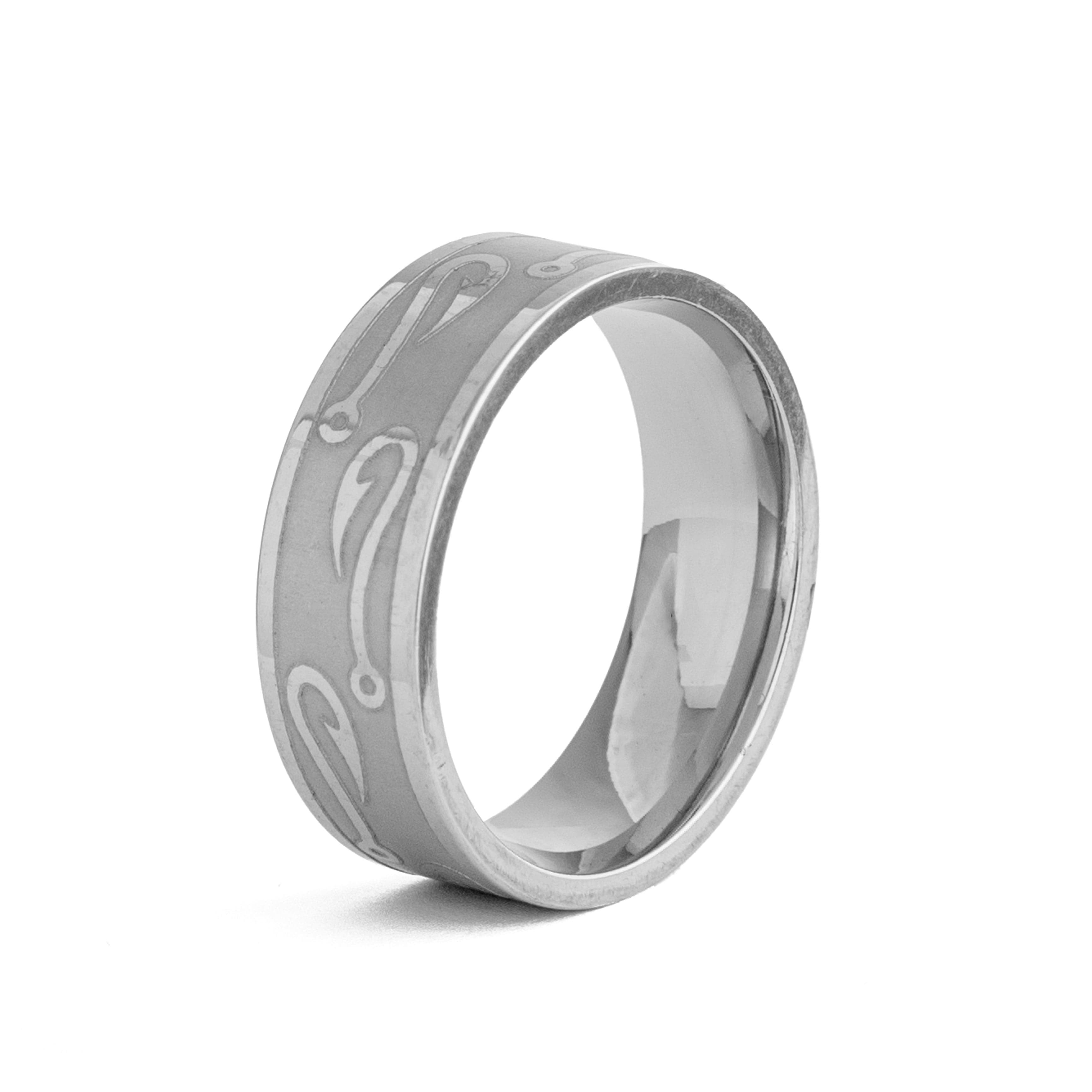 Silver band ring with a subtle repeating wave pattern.