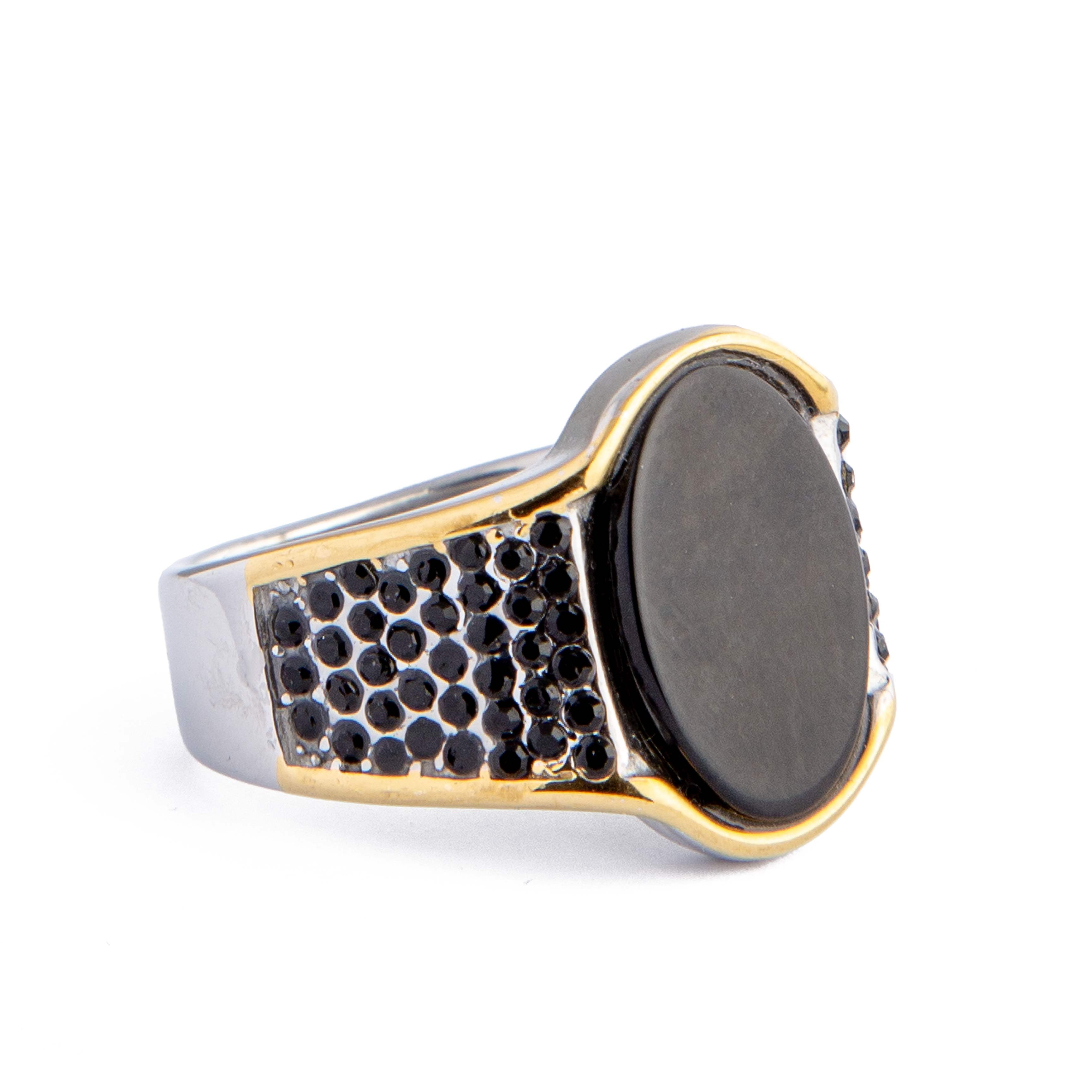 Men's black onyx ring with textured band and gold accents