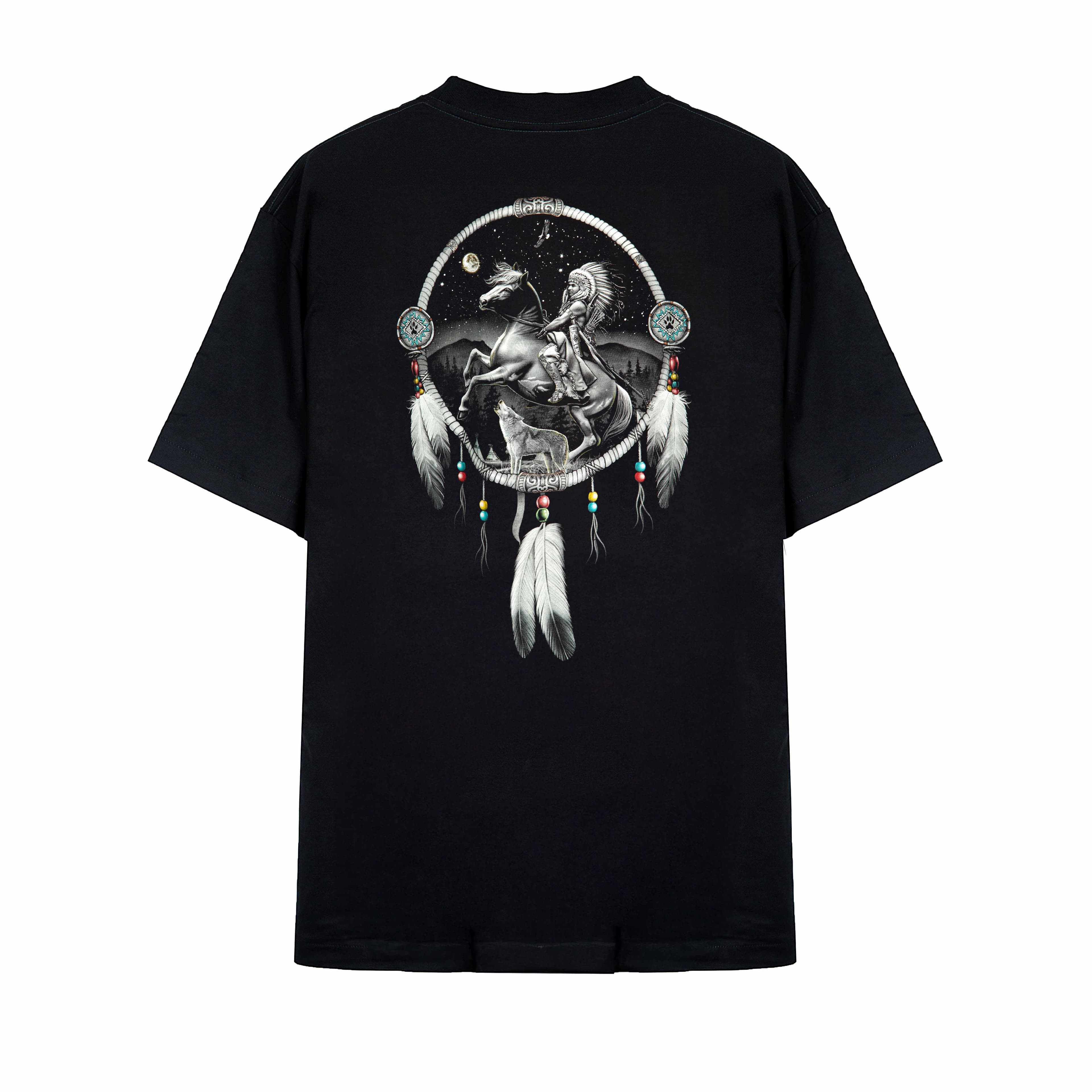 Rock Eagle black unisex t-shirt with a detailed graphic of a Native American Chief in a feather bonnet kneeling by a campfire near a teepee under a star-lit night sky.