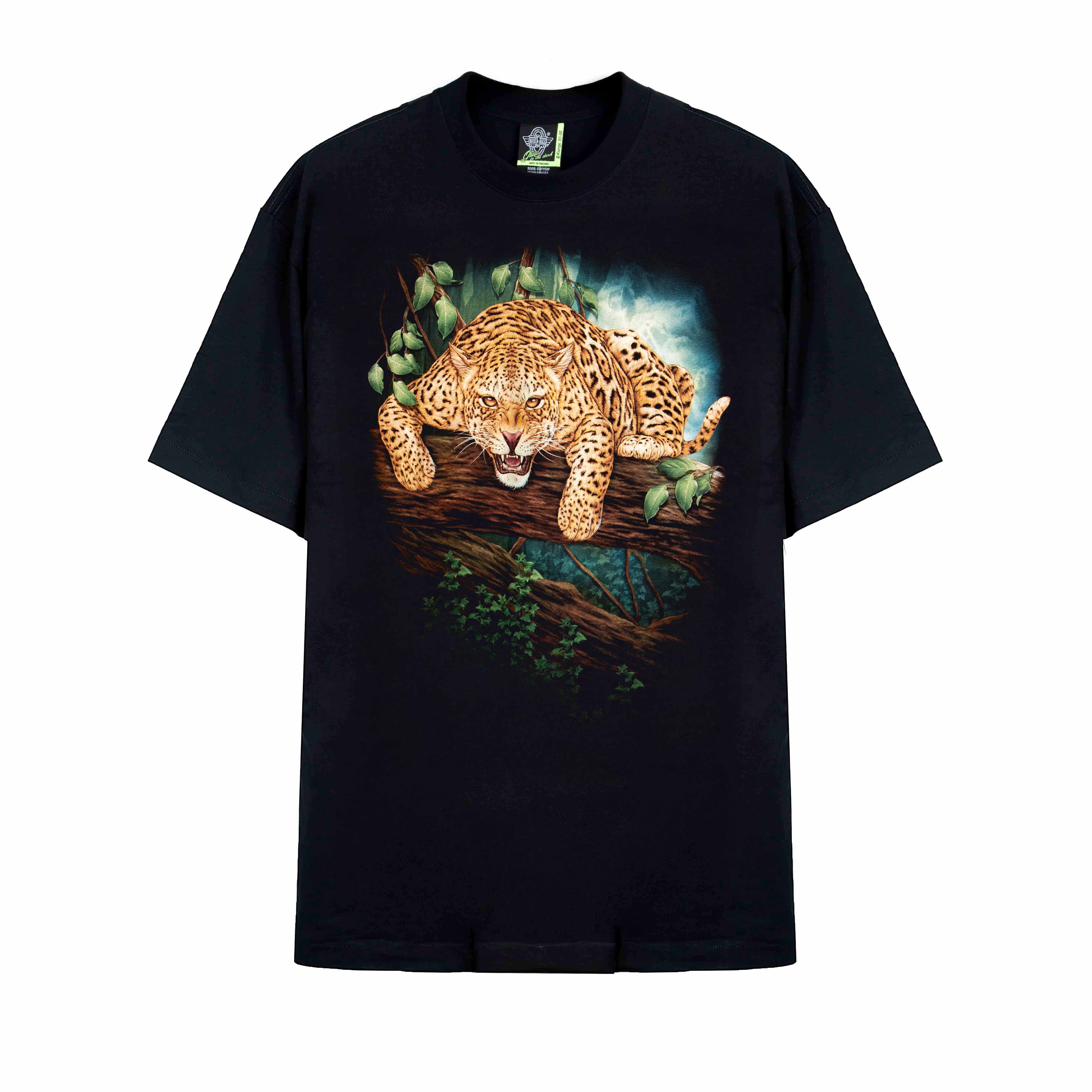 Rock Eagle black unisex t-shirt with a fierce, realistic graphic of a jaguar crouching on a jungle tree branch, staring forward with an open mouth.