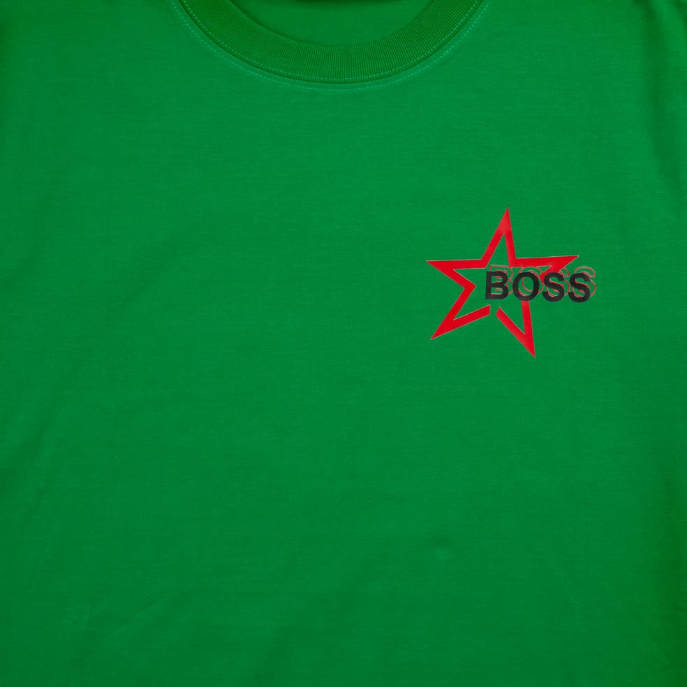 This is a classic crew-neck t-shirt featuring the BOSS logo within a striking red star graphic print on the left chest.