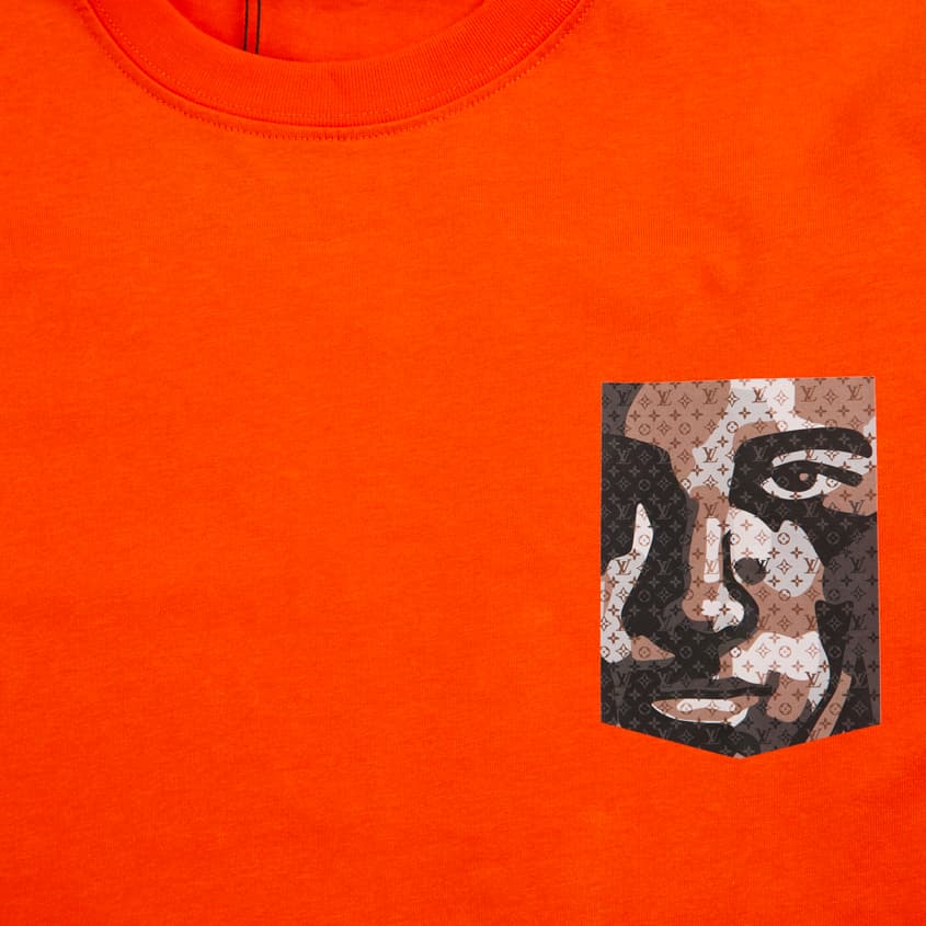 This is a vibrant, short-sleeved crew-neck t-shirt featuring a unique graphic detail.