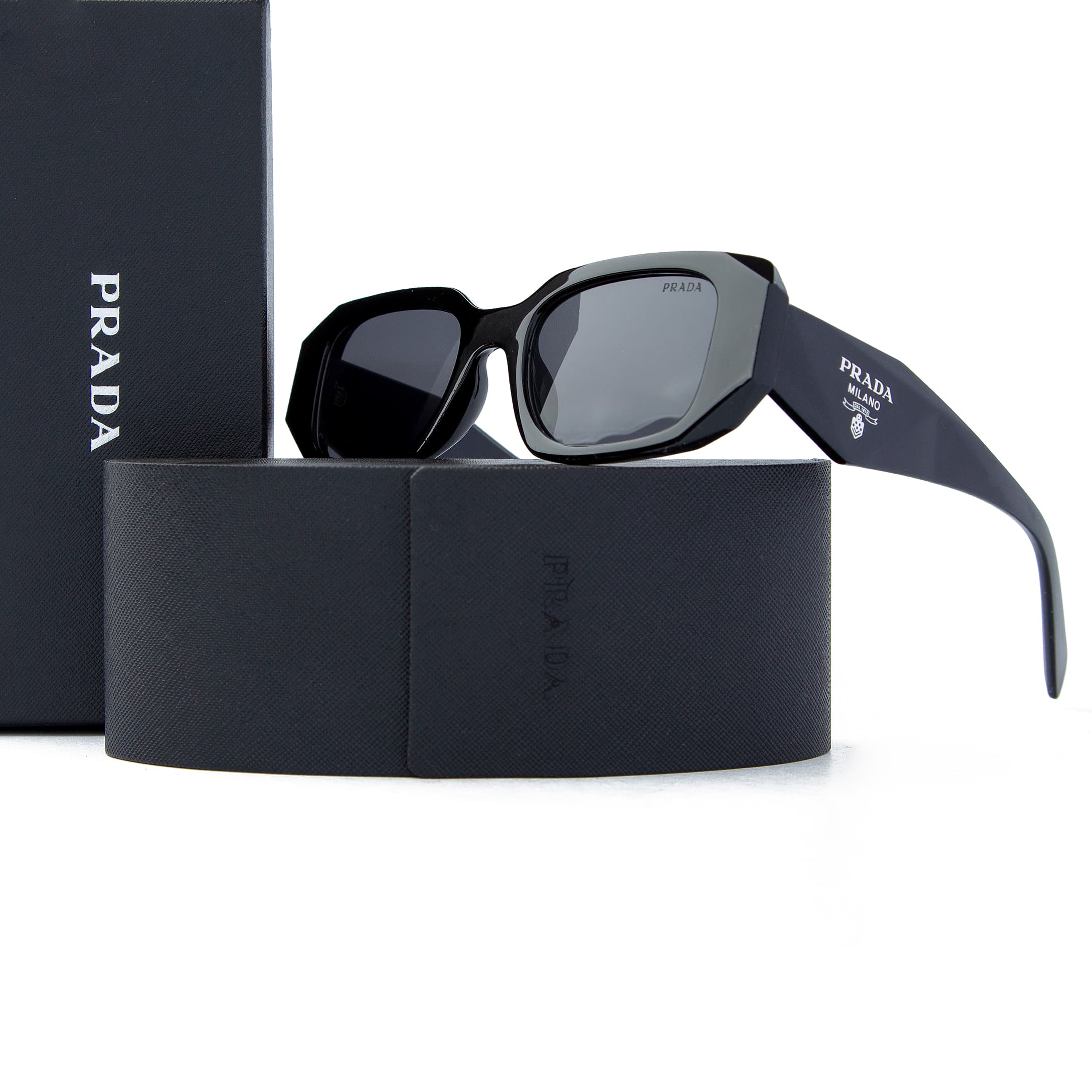Prada rectangular black sunglasses with dark tinted lenses and Prada Milano logo detailing, offering bold unisex style and UV protection for fashion enthusiasts.