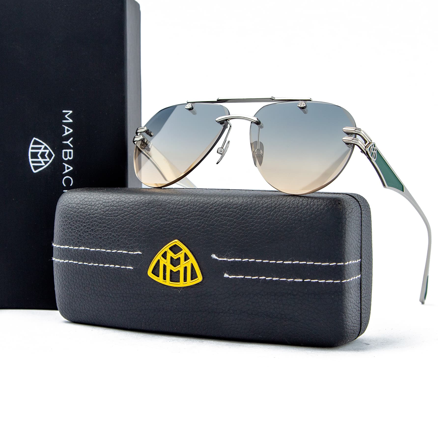 Maybach aviator sunglasses with silver-tone frames and gradient grey-brown lenses, a luxurious unisex design with iconic Maybach branding