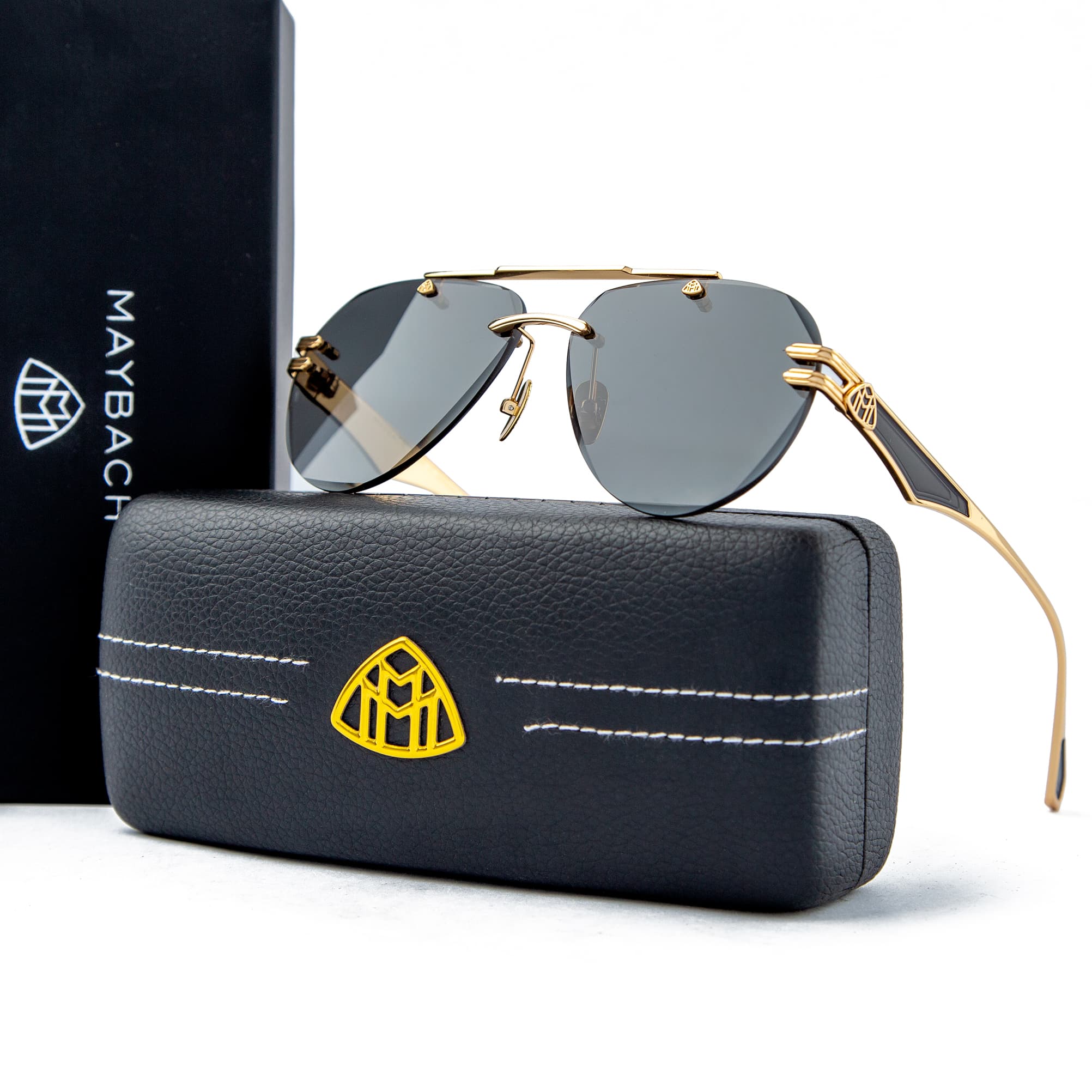 Maybach aviator sunglasses with a gold-tone frame and polarized grey lenses, a luxurious unisex design with iconic Maybach branding.