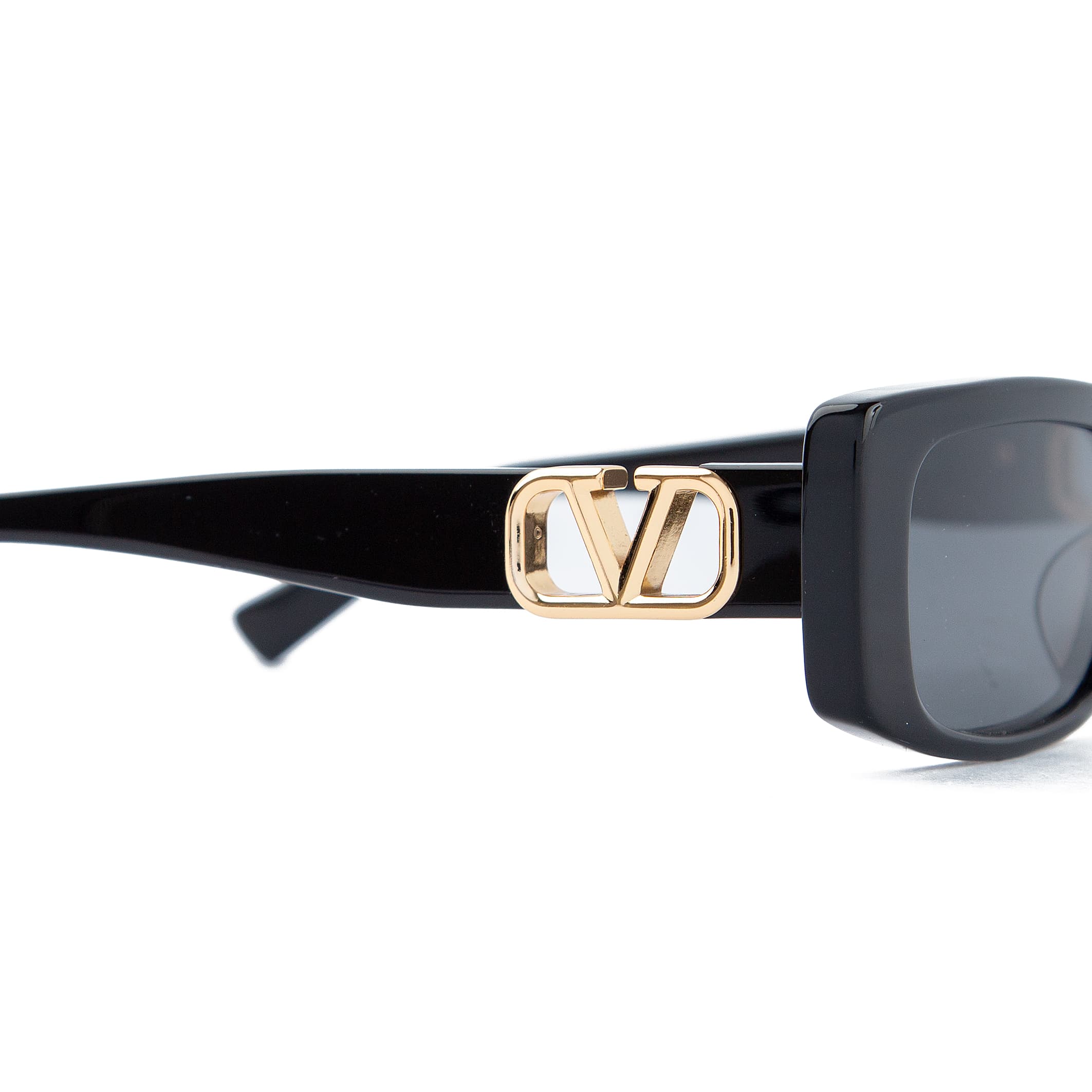 Valentino rectangular black sunglasses with gold logo accents and grey-tinted lenses. Unisex designer eyewear for a luxurious and stylish look.