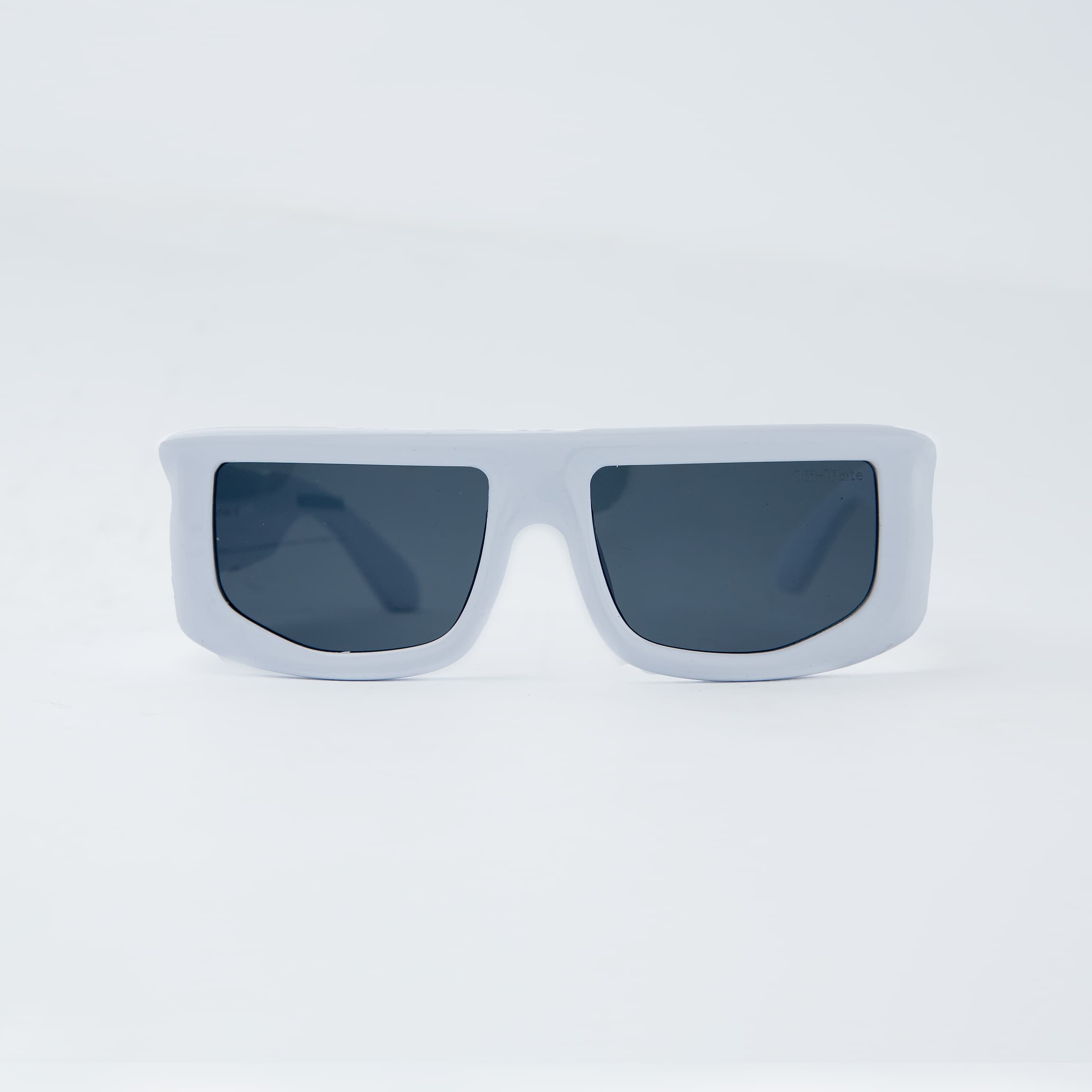 Off-White rectangular white sunglasses with black-tinted lenses, featuring a bold and modern design. Unisex eyewear for a stylish and contemporary look
