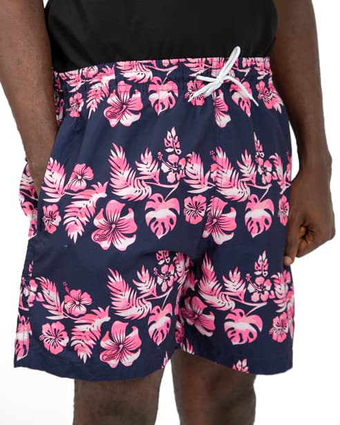 Navy blue swim shorts with pink and white floral print, featuring an elastic waistband and drawstring closure