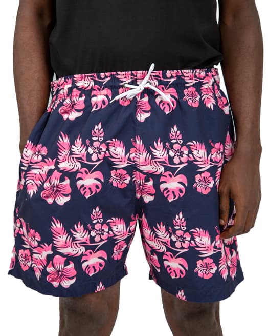 Navy blue swim shorts with pink and white floral print, featuring an elastic waistband and drawstring closure.