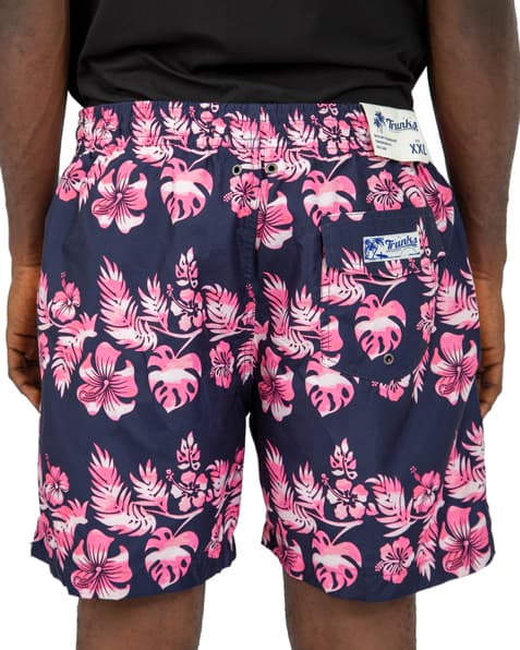 Navy blue swim shorts with pink and white floral print, featuring an elastic waistband and drawstring closure
