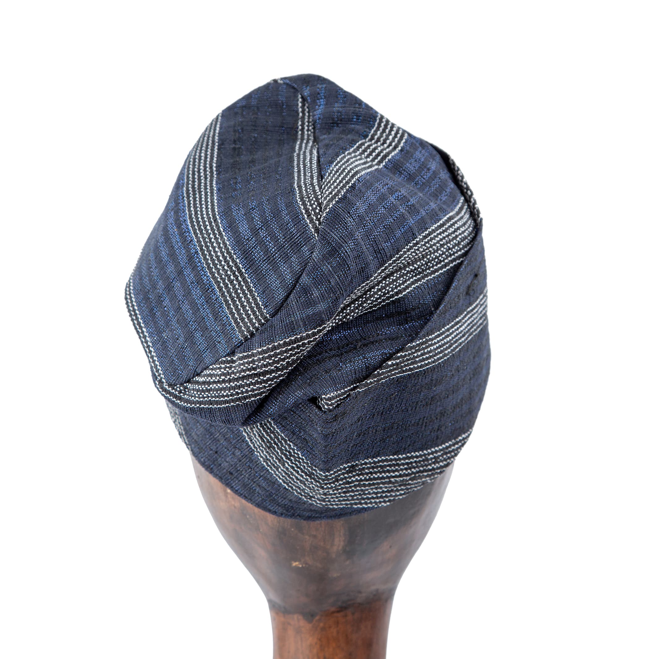 Classic navy blue Aso Oke cap with silver stripes, unisex traditional headwear ideal for weddings, cultural events, and modern fashion styling.