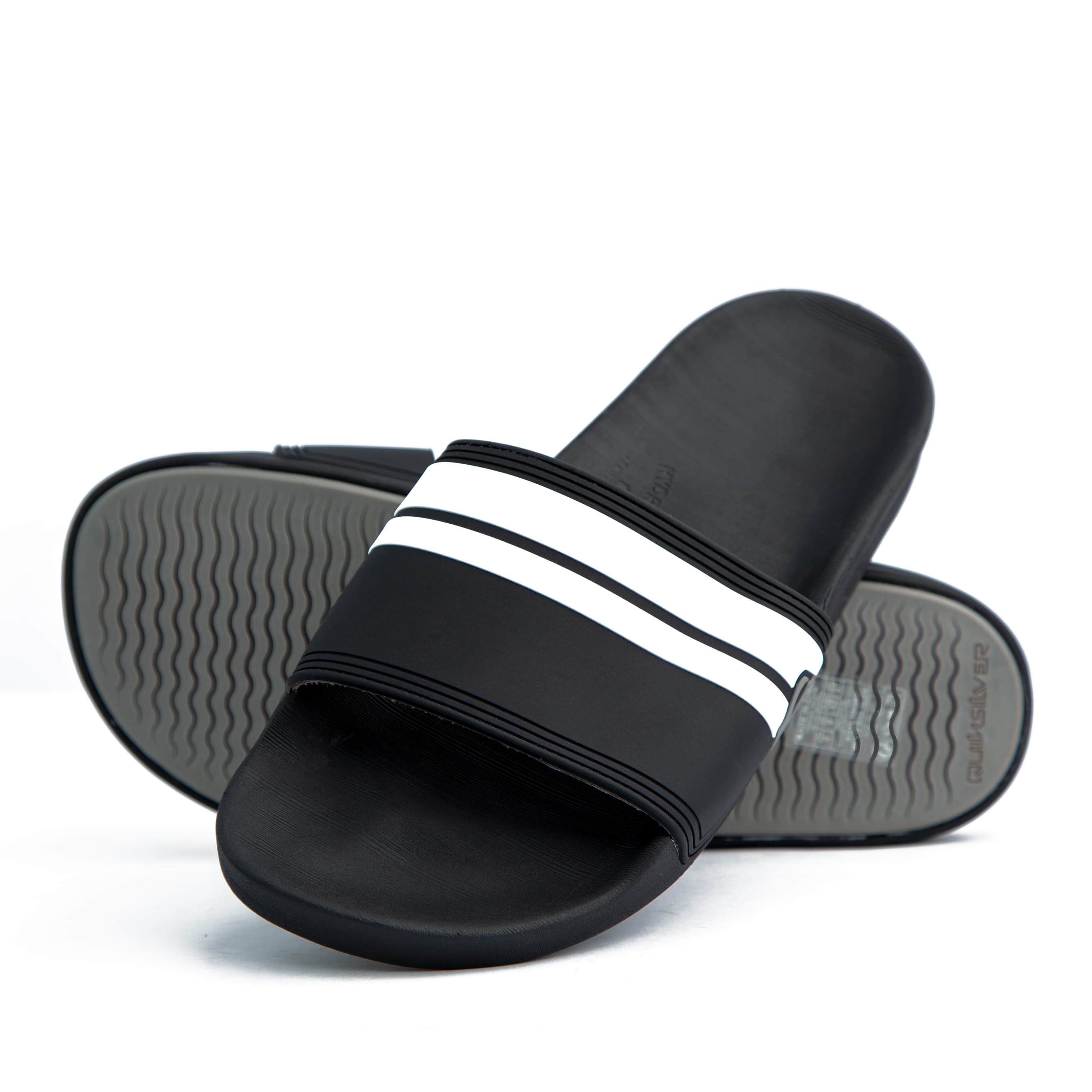  Black Adidas Adilette Comfort Slides with white stripes – stylish, lightweight, and cushioned for ultimate comfort. Perfect for casual and sporty looks.