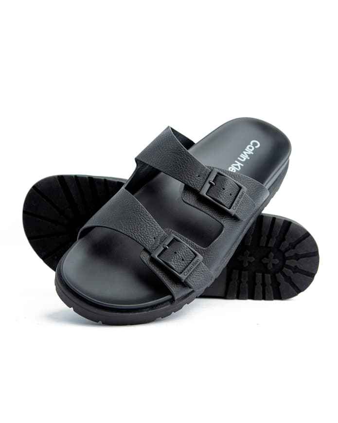 Upgrade your footwear collection with Calvin Klein Black Double Strap Sandals. Designed for comfort and style, these durable sandals offer a perfect fit for every step.