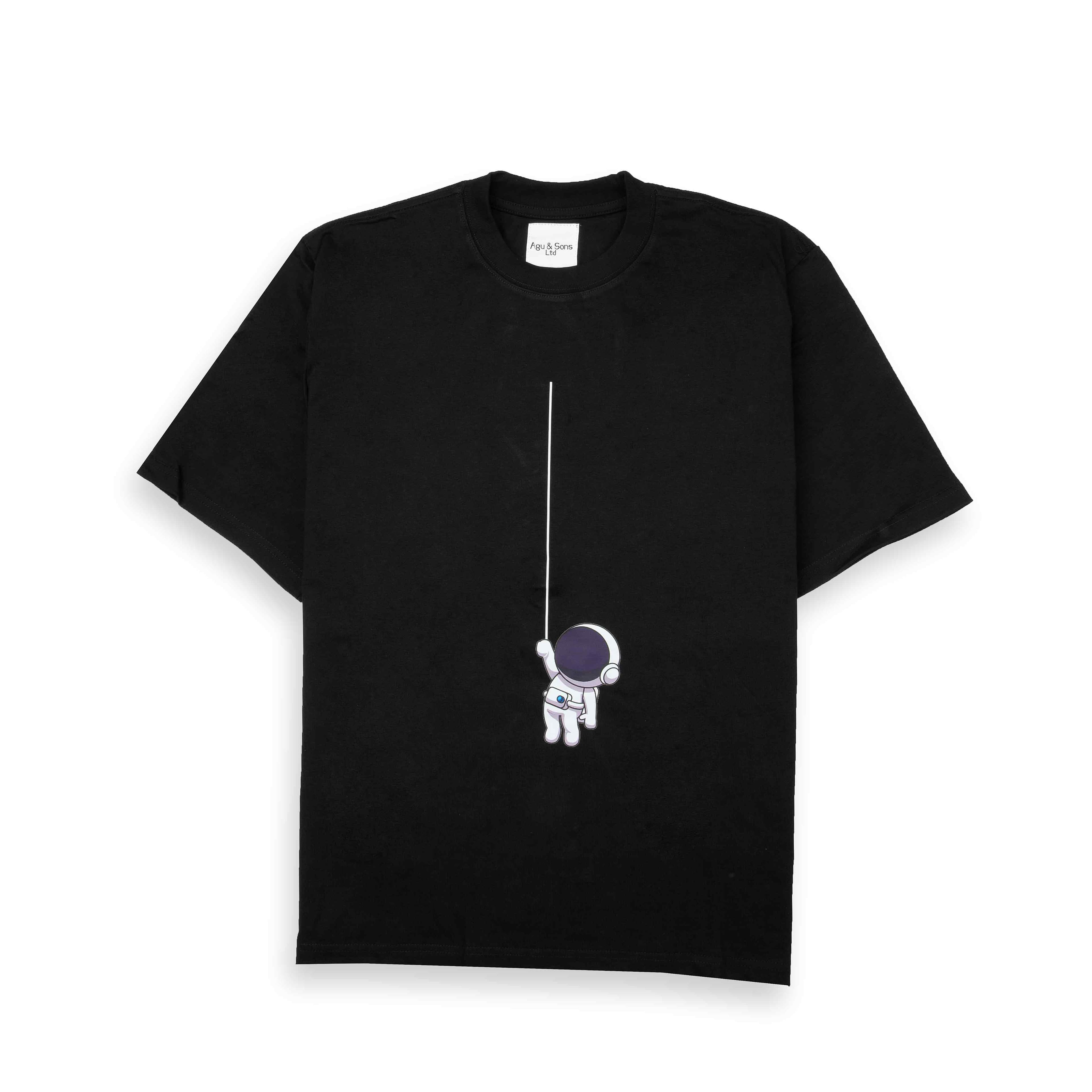 Black t-shirt with small astronaut on a line graphic. Minimalist space tee.