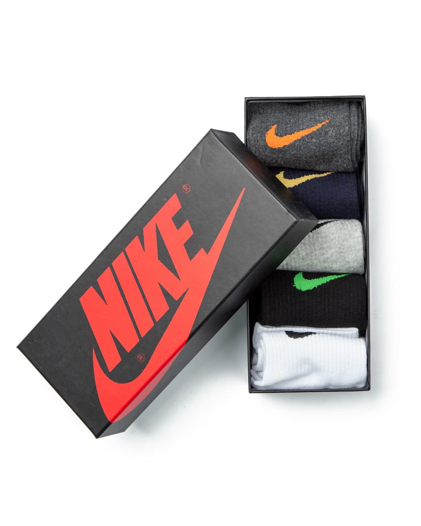 Nike Everyday Plus Crew Socks - Multi-Pack, featuring grey, navy, light grey, black, and white pairs with contrasting Nike logo detailing.
