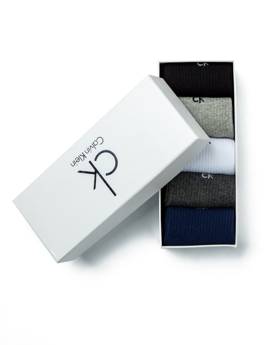 Calvin Klein Men's Assorted Crew Socks Multi-Pack, featuring black, grey, white, dark grey, and navy pairs with contrast logo detailing