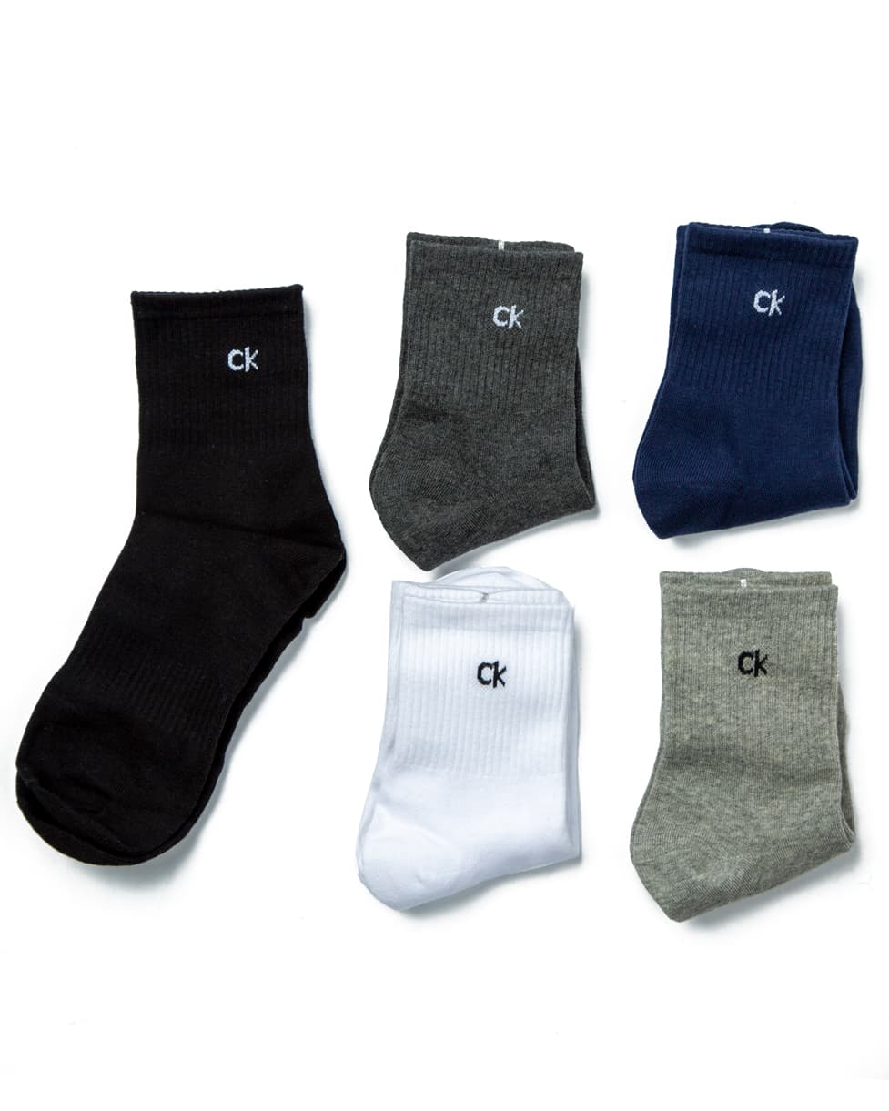 Calvin Klein Men's Assorted Crew Socks Multi-Pack, featuring black, grey, white, dark grey, and navy pairs with contrast logo detailing.