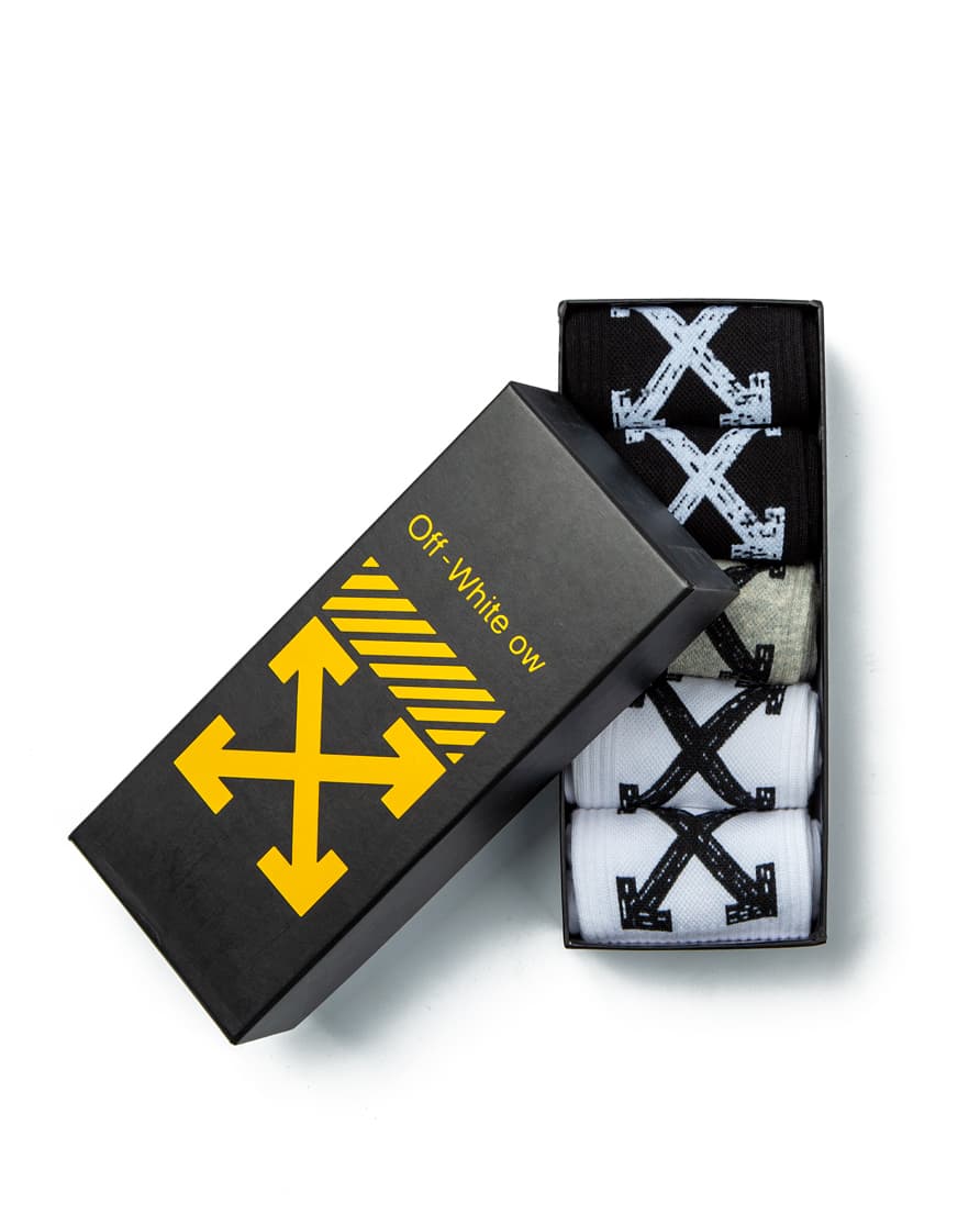 Off-White Arrow Motif Socks Multi-Pack, featuring black, grey, and white pairs with signature diagonal stripes and arrow logo detailing.