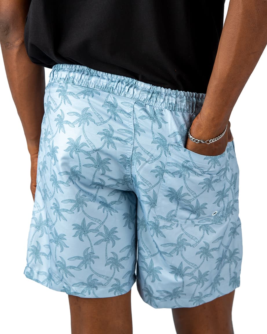 Light blue men's beach shorts with palm tree print and drawstring waist – quick-dry fabric, perfect for summer, pool, and vacation wear.