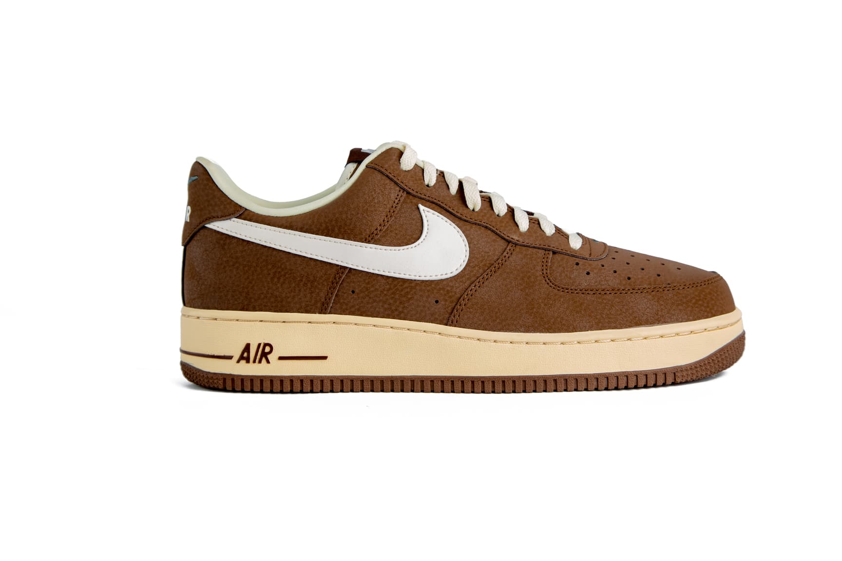 Classic brown and white low-top sneakers with cushioned soles, perfect for casual wear. Stylish, durable, and designed for ultimate comfort