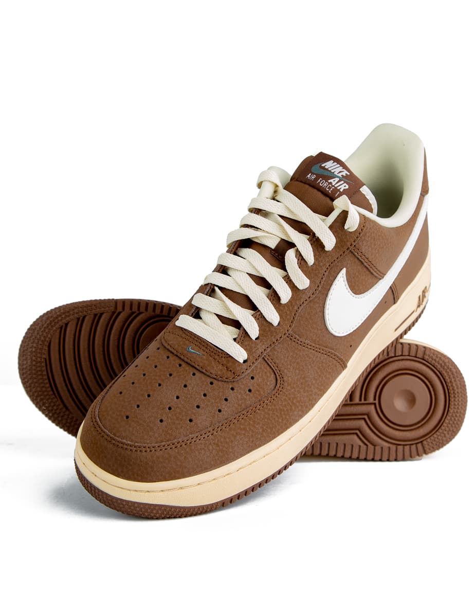 Classic brown and white low-top sneakers with cushioned soles, perfect for casual wear. Stylish, durable, and designed for ultimate comfort.