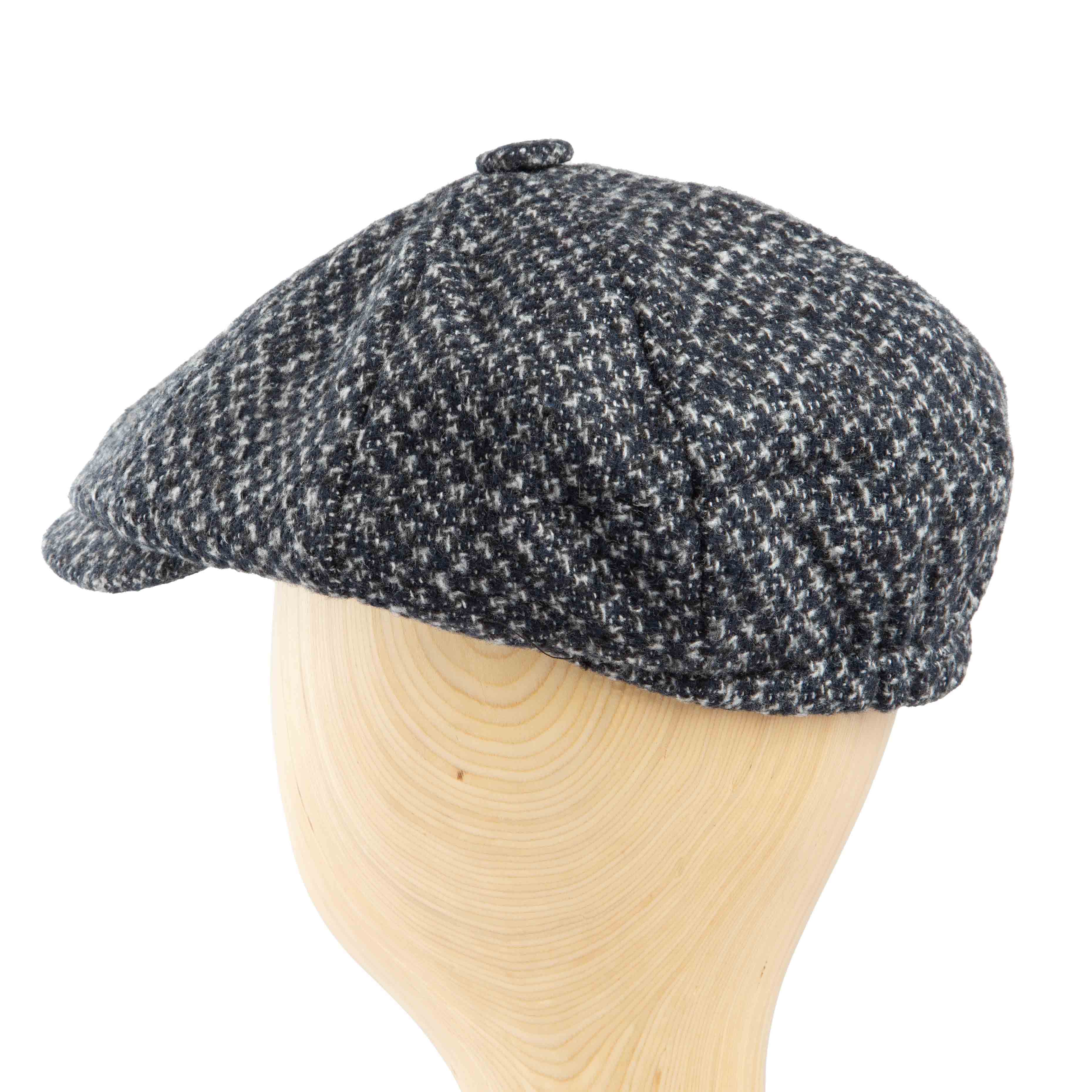 Stylish black and white speckled tweed flat cap for men, perfect for a modern classic look.