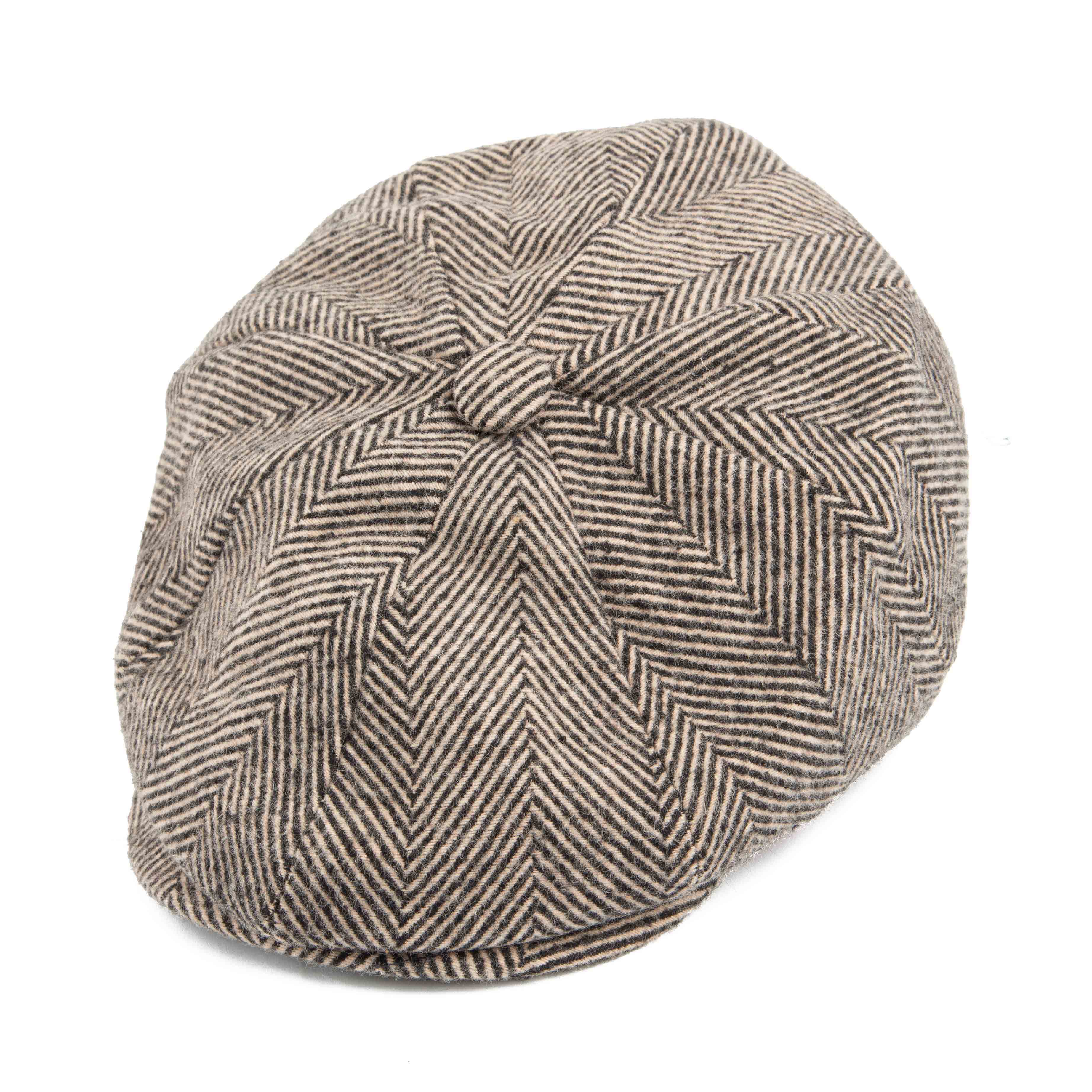 Classic black and white herringbone newsboy cap for men, perfect for vintage or versatile everyday wear.