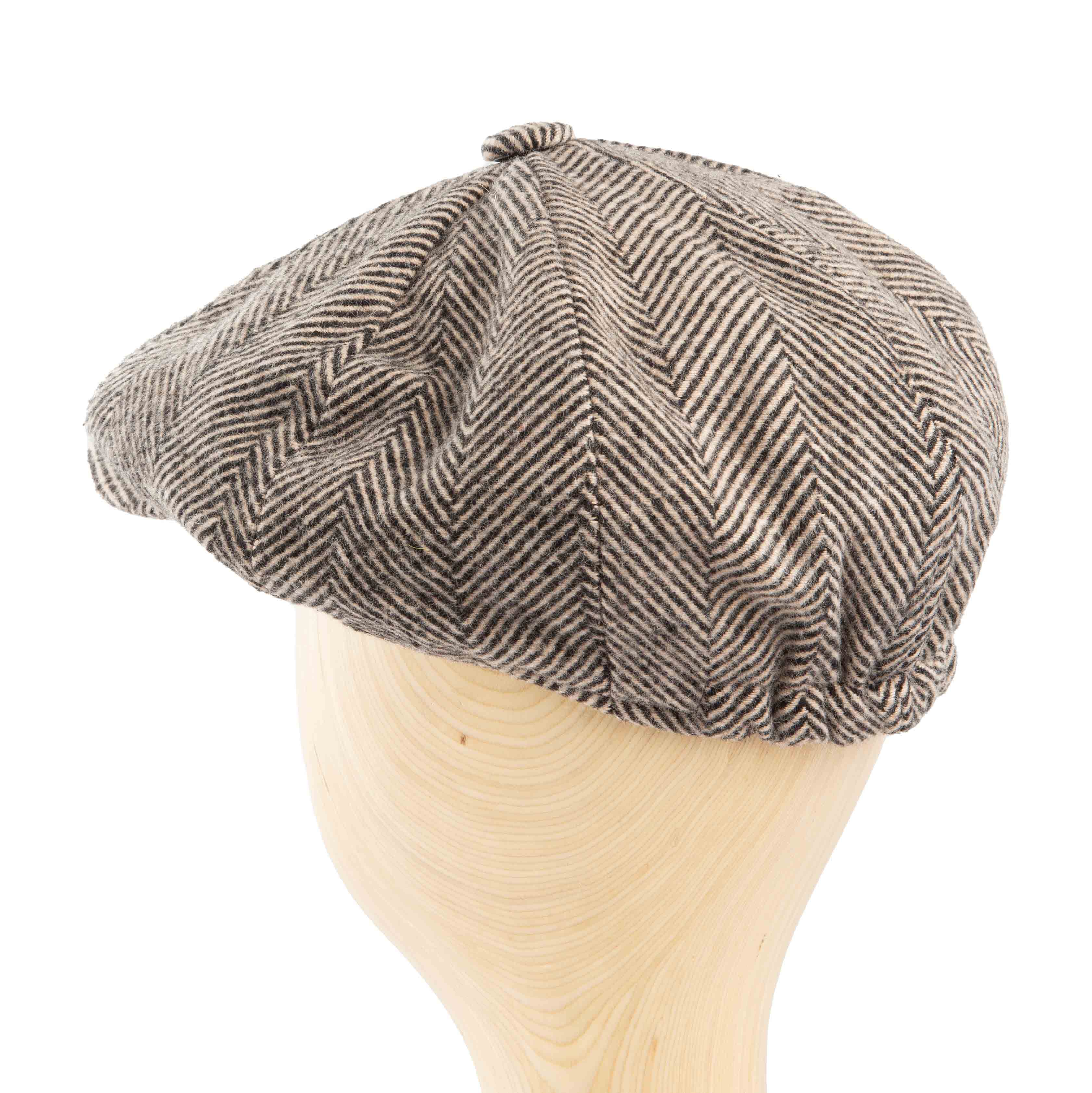 Classic black and white herringbone newsboy cap for men, perfect for vintage or versatile everyday wear.