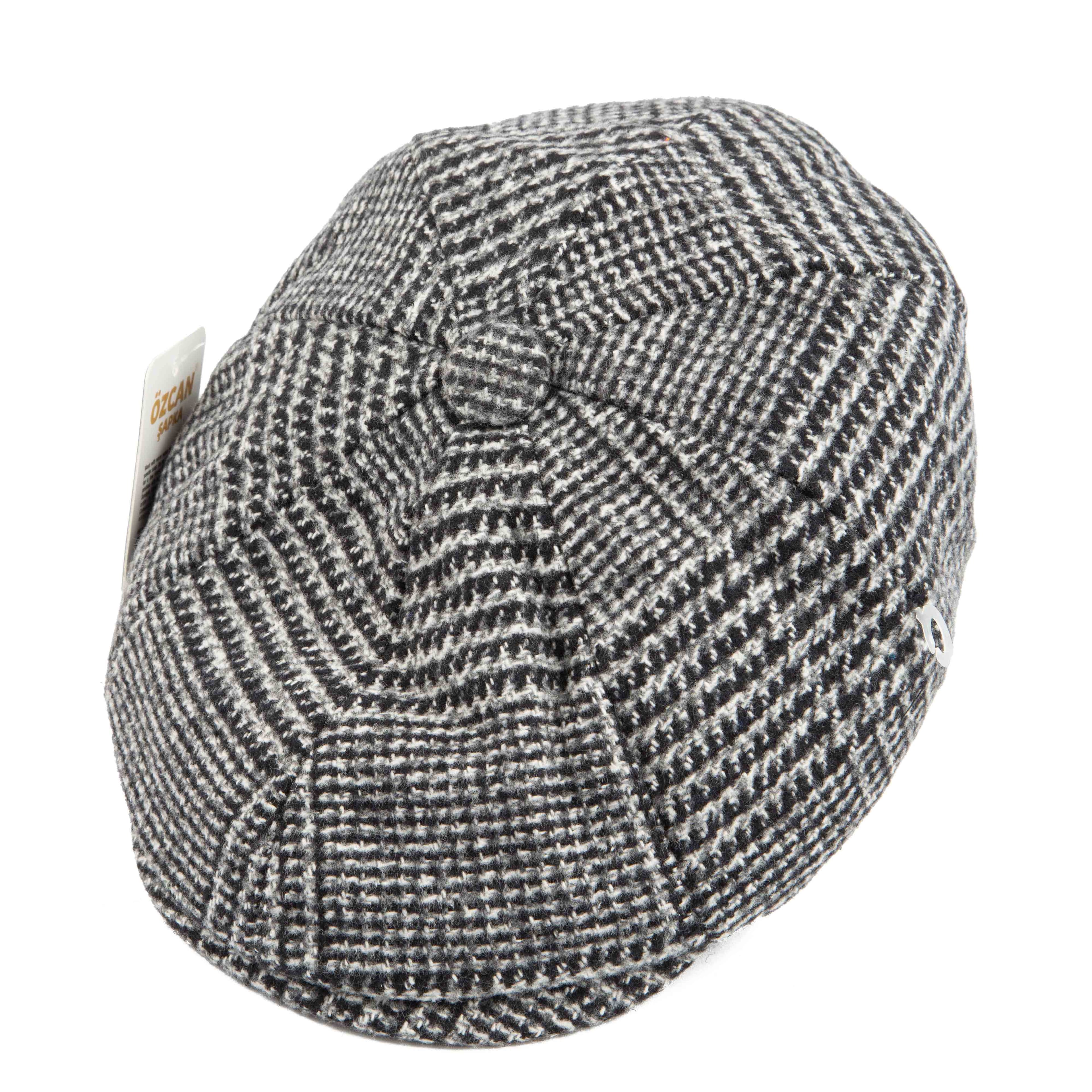 Black and white plaid newsboy cap - classic unisex style with houndstooth pattern and ÖZCAN tag.