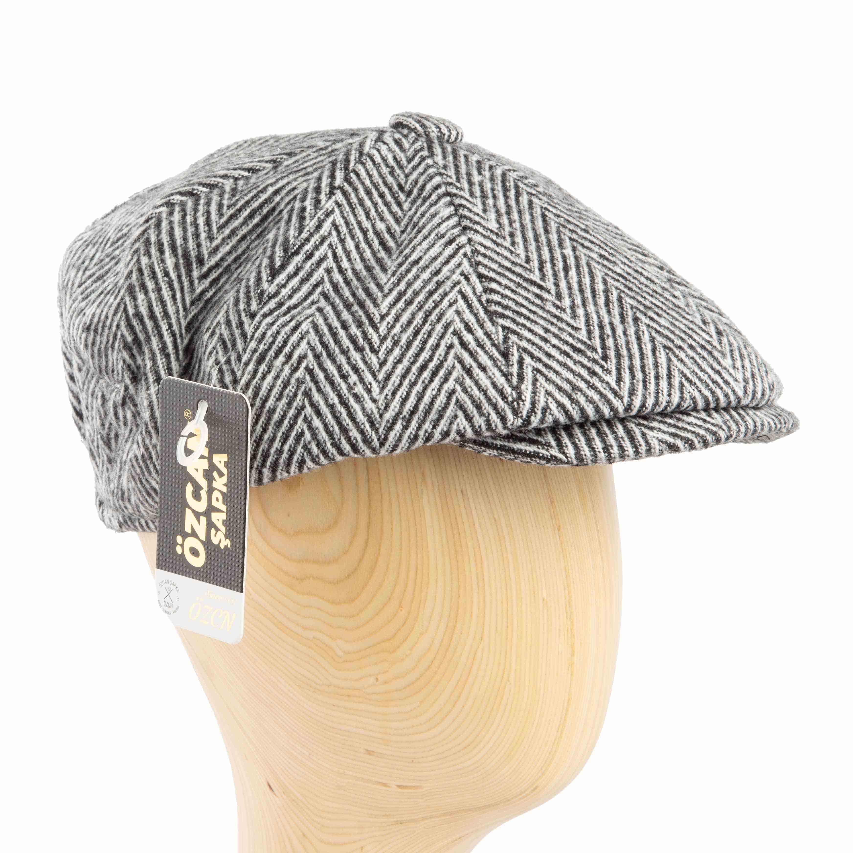 This is a stylish flat cap, also often categorized as a newsboy or ivy cap due to its multi-paneled crown and slightly rounded shape. 