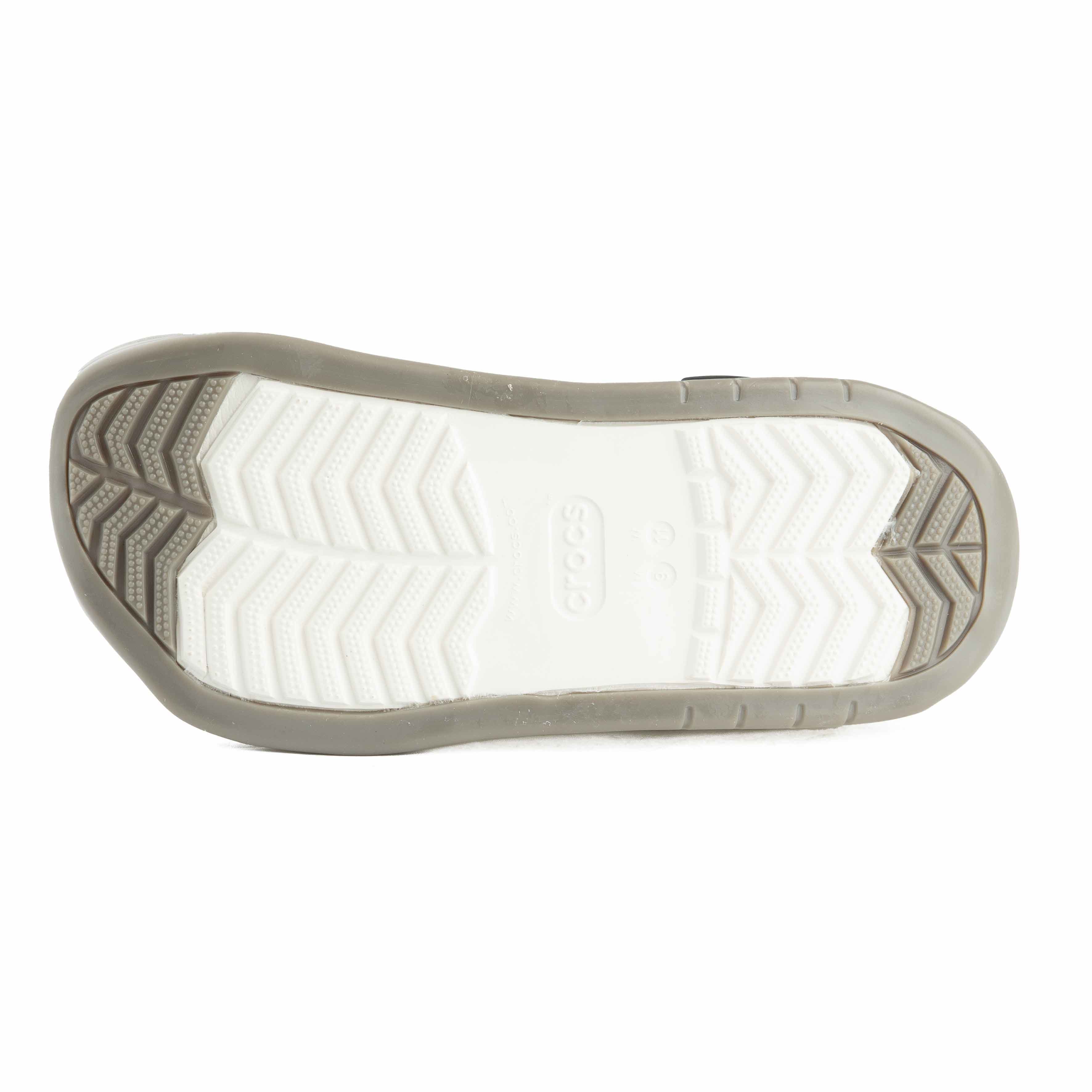 Two-tone black and white platform clogs, side view.