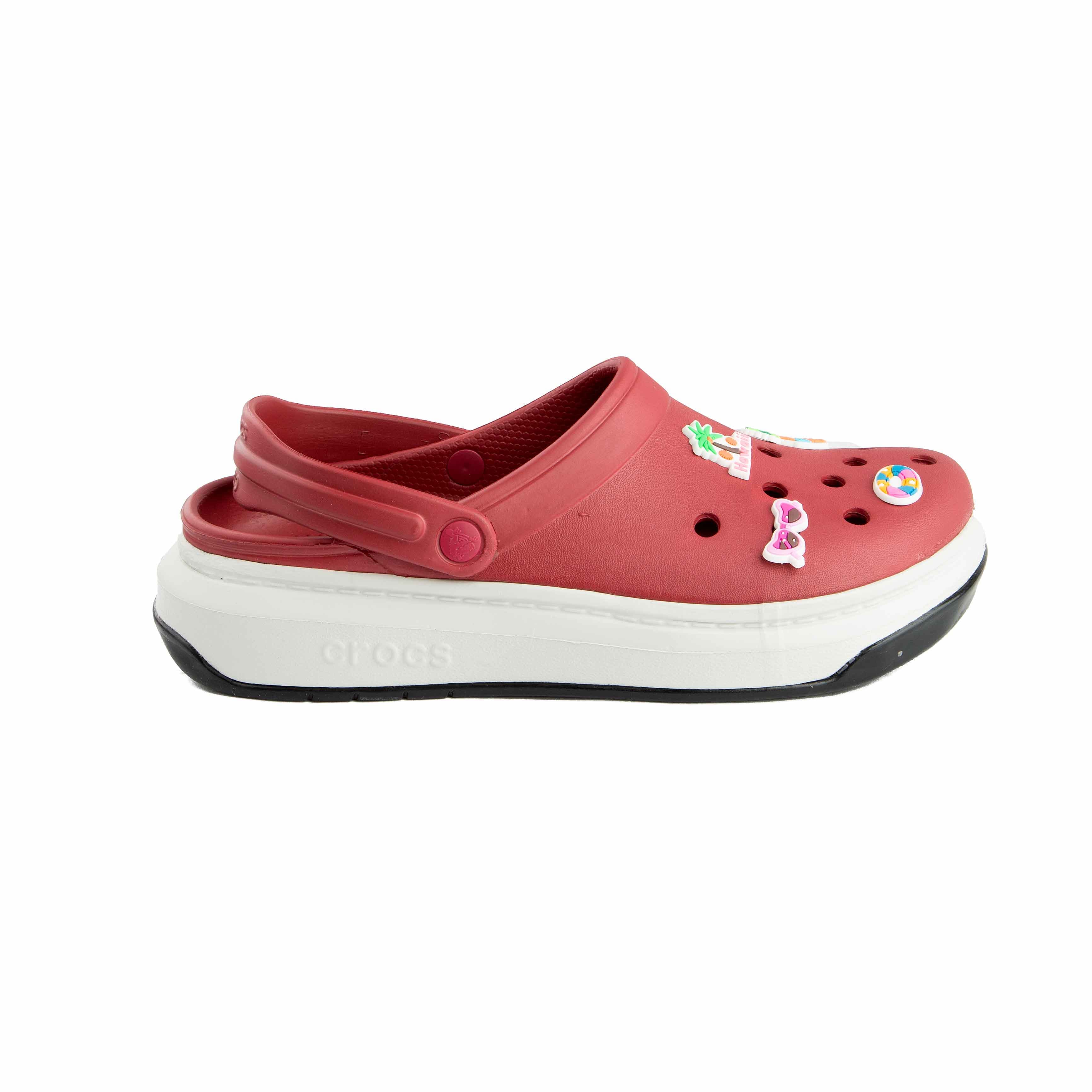 Maroon platform clogs with assorted colorful summer-themed decorative charms, side view.