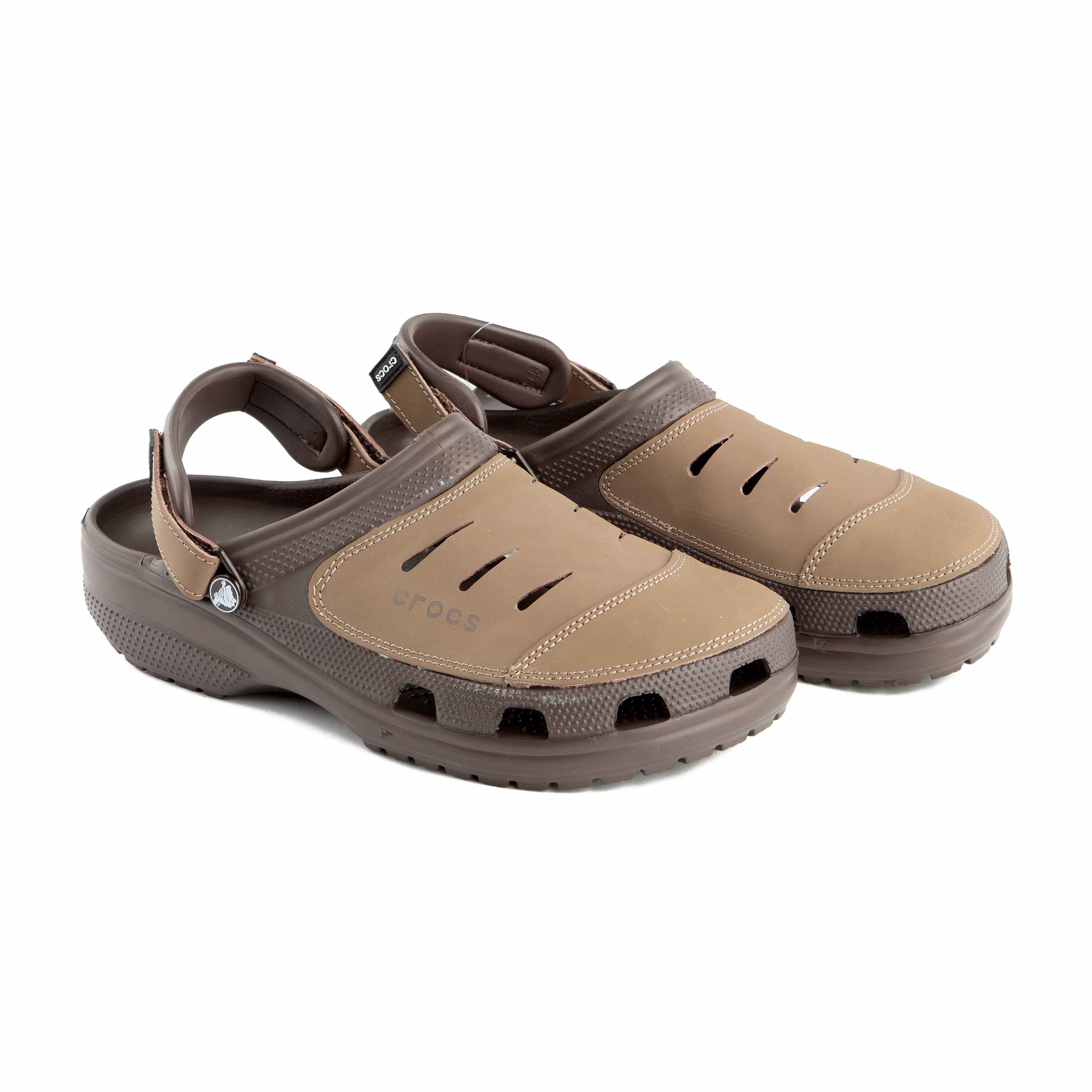 This is a pair of multi-toned brown Crocs clogs designed for rugged or water-friendly environments.
