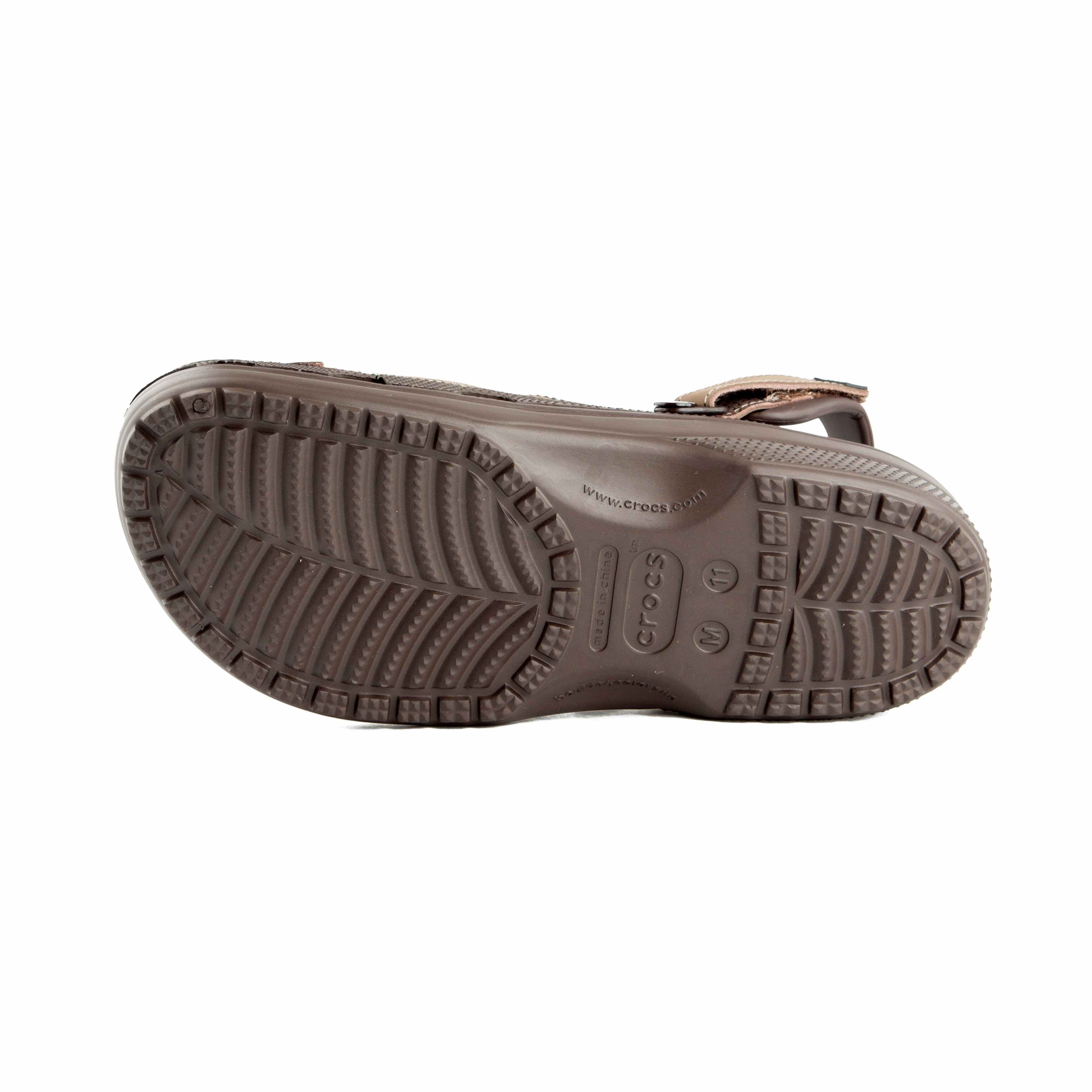 This is a pair of multi-toned brown Crocs clogs designed for rugged or water-friendly environments.