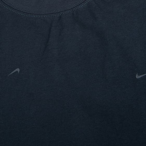 Nike x Jacquemus dark navy blue Dri-FIT t-shirt with all-over debossed logos."