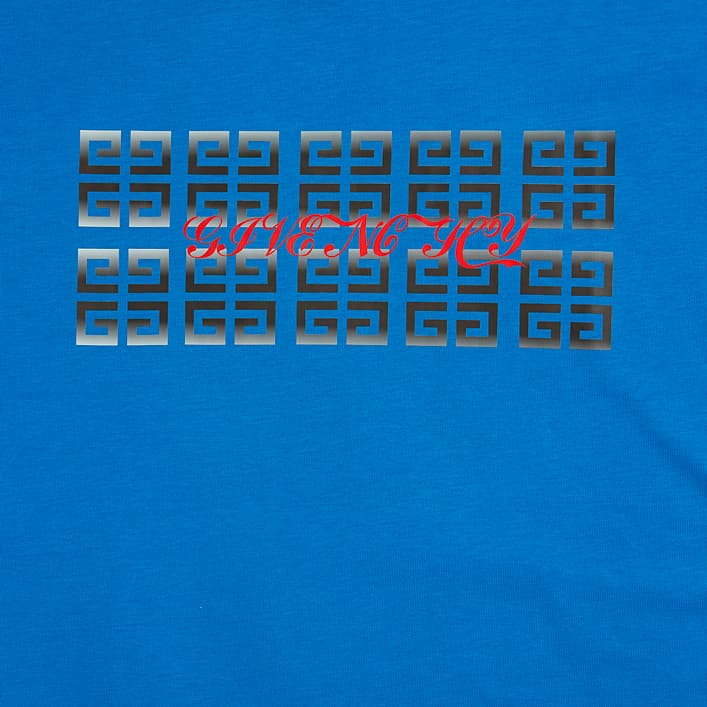 Bold cobalt blue t-shirt with a unique digital matrix graphic logo in red and metallic grey.