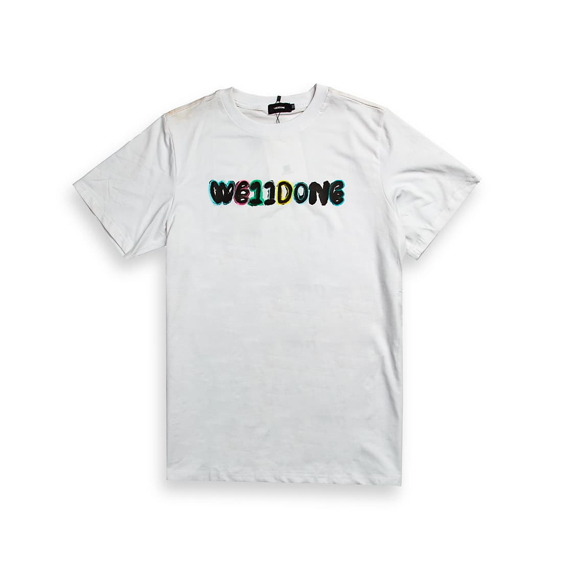 White WE11DONE graphic t-shirt with glitch logo, short sleeves, streetwear style, laid flat.