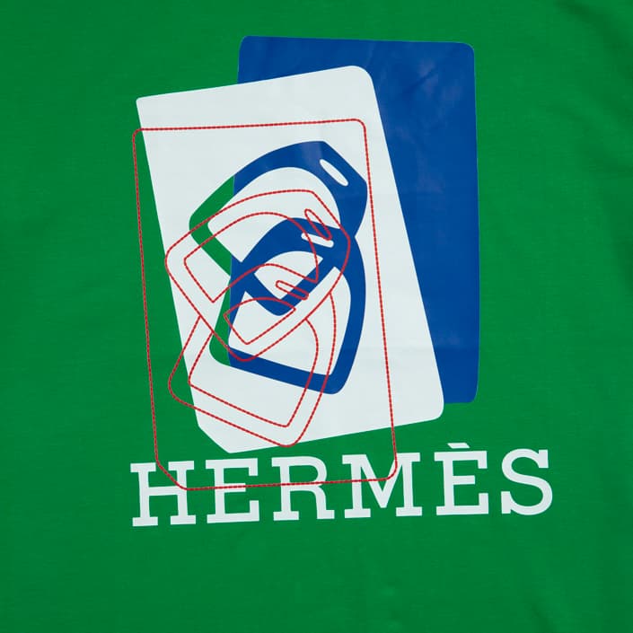 Kelly Green Hermès t-shirt with modern blue and white abstract graphic logo print, luxury designer unisex wear.