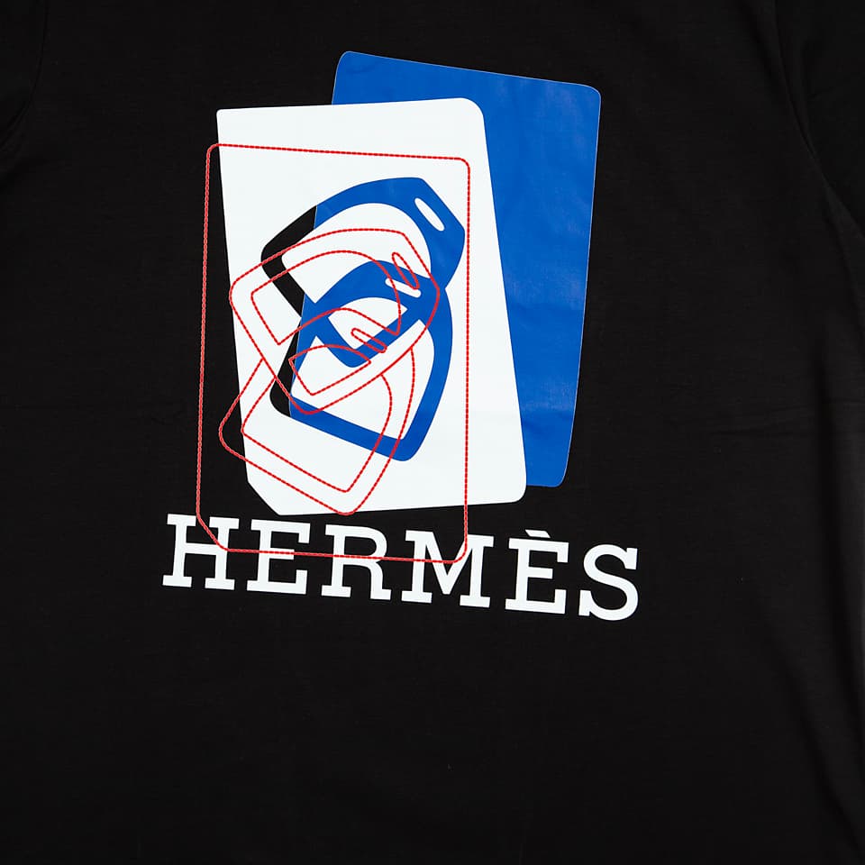 Black Hermès t-shirt with modern blue and white abstract graphic logo print, luxury designer unisex wear.
