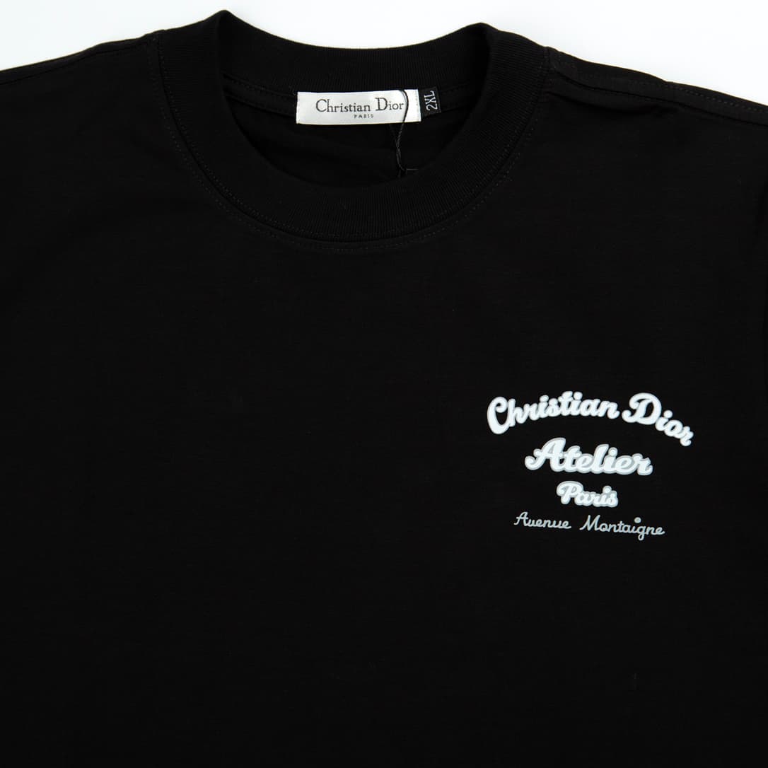 Black Christian Dior t-shirt with white script Atelier Paris Avenue Montaigne logo graphic, luxury unisex wear.