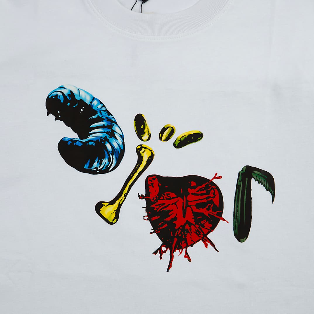 White Christian Dior t-shirt with surreal abstract creature and bone graphic print, luxury designer unisex wear.