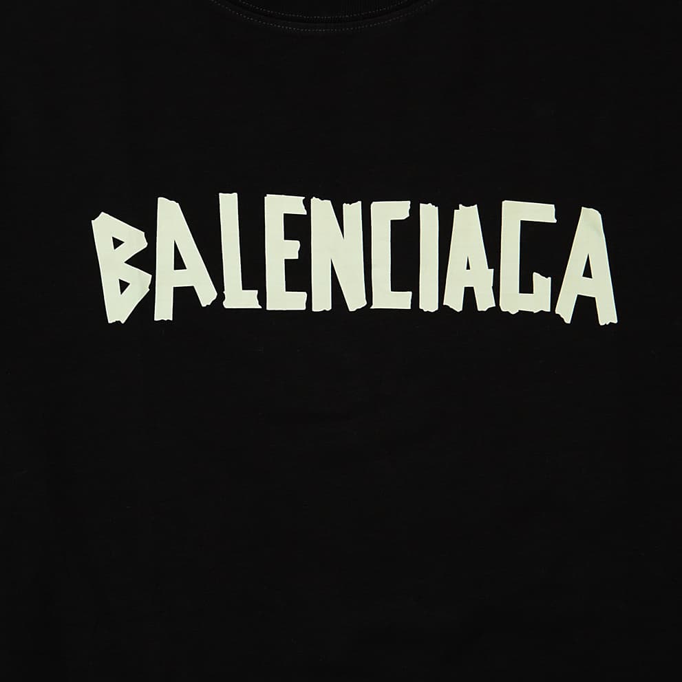 A classic crewneck, short-sleeve T-shirt in cotton jersey, featuring the brand's logo in a striking, intentionally distorted font.
