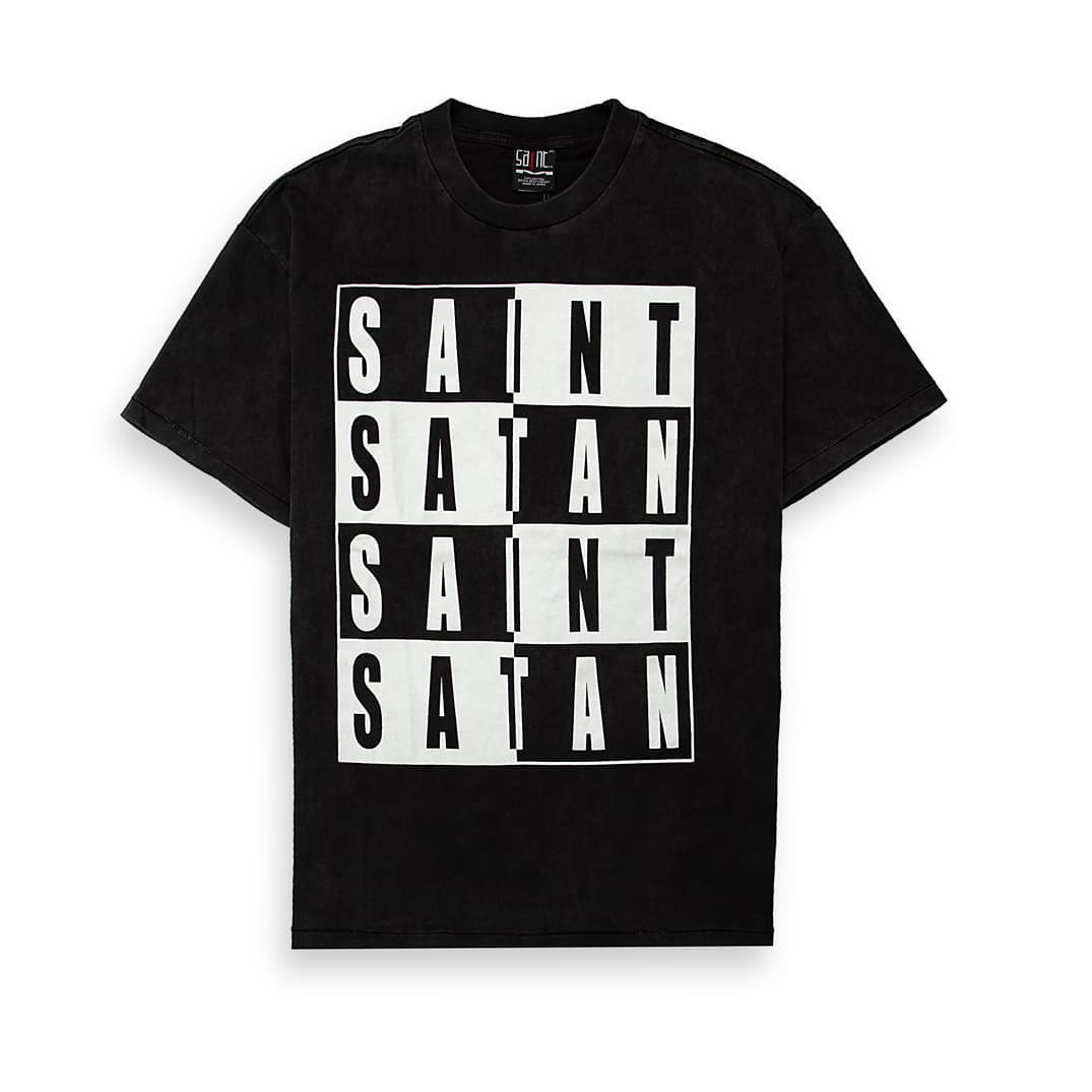 This is a relaxed-fit, short-sleeved graphic t-shirt featuring a striking black and white split design.