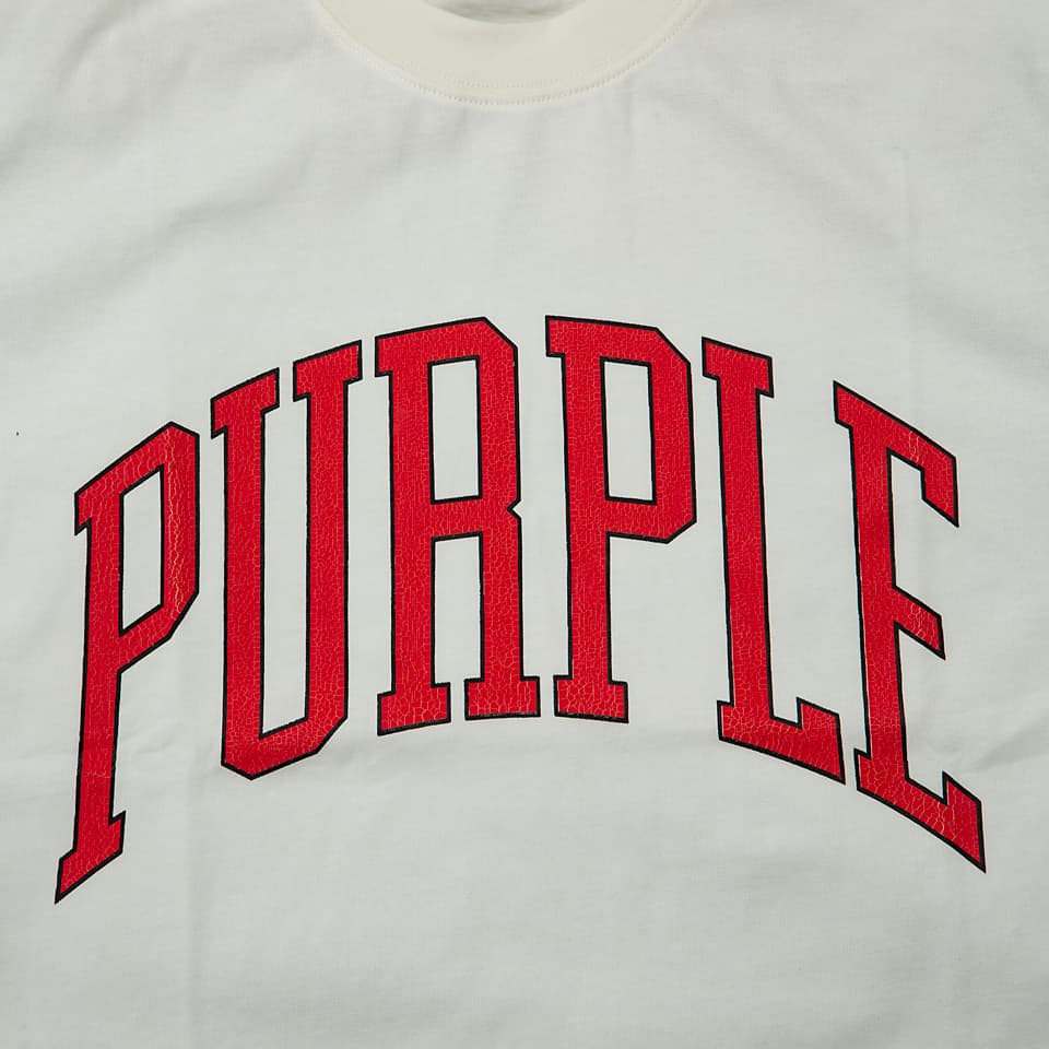 A premium, short-sleeve crewneck t-shirt from the brand PURPLE, known for its luxury streetwear aesthetic.