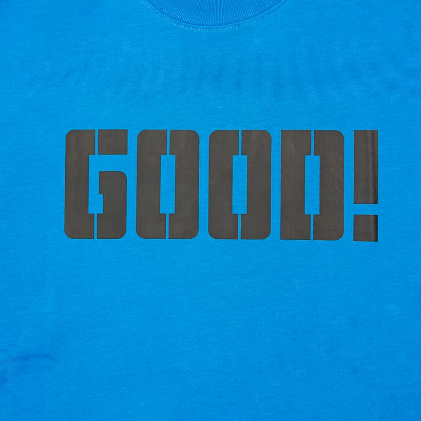 Royal Blue t-shirt with bold black stencil print "GOOD!" graphic on chest, short sleeves, unisex streetwear.