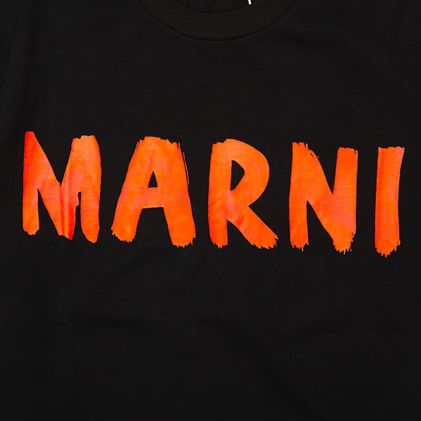Black Marni t-shirt with large orange brushstroke logo graphic on chest, short sleeves, designer unisex streetwear.