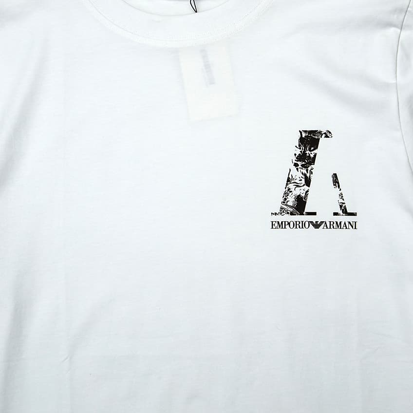 White Emporio Armani t-shirt with small distressed 'A' and text logo on chest, designer unisex casual wear.